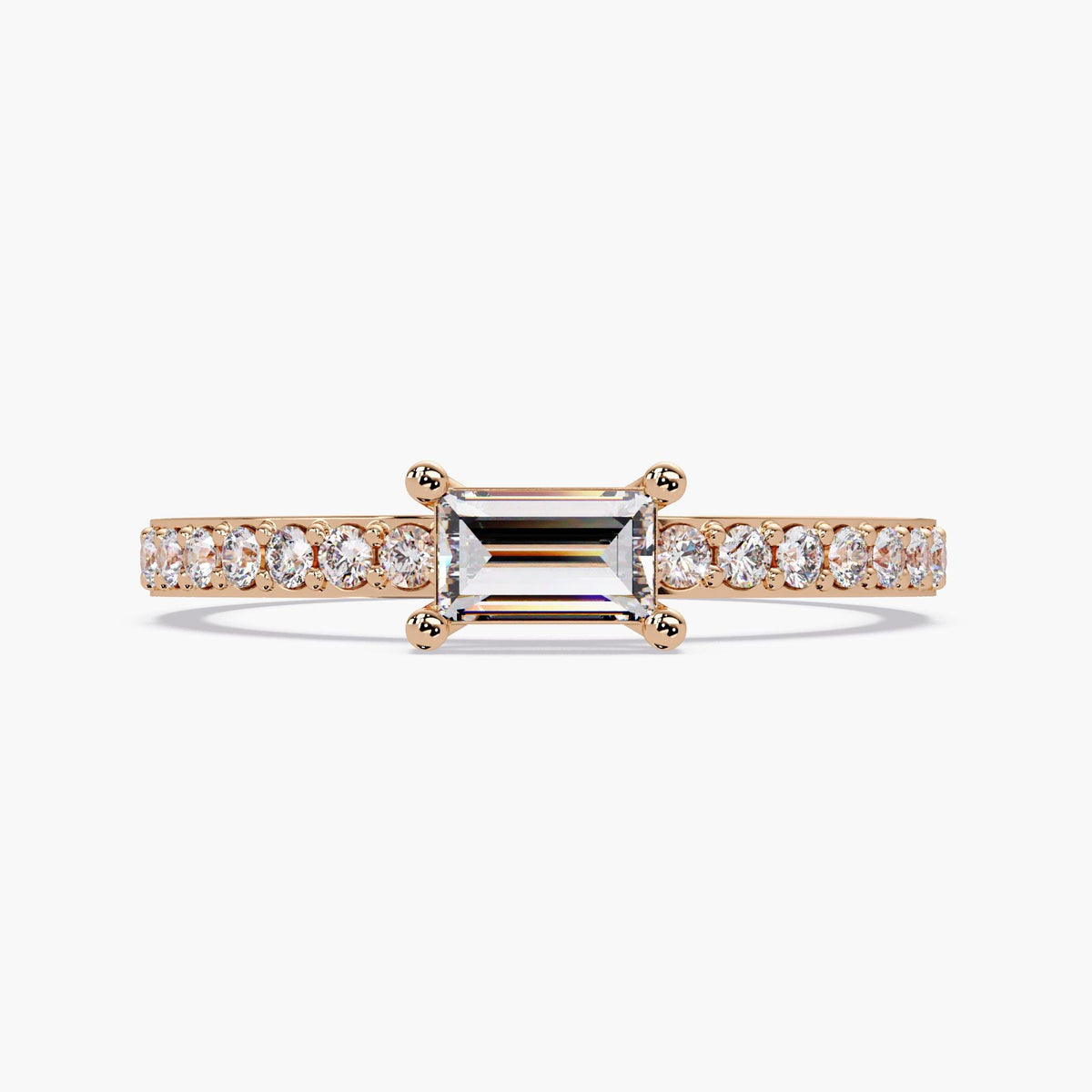 14K rose gold baguette diamond ring with 0.40 CTW lab-grown center stone in an east-west solitaire setting and petite pave band