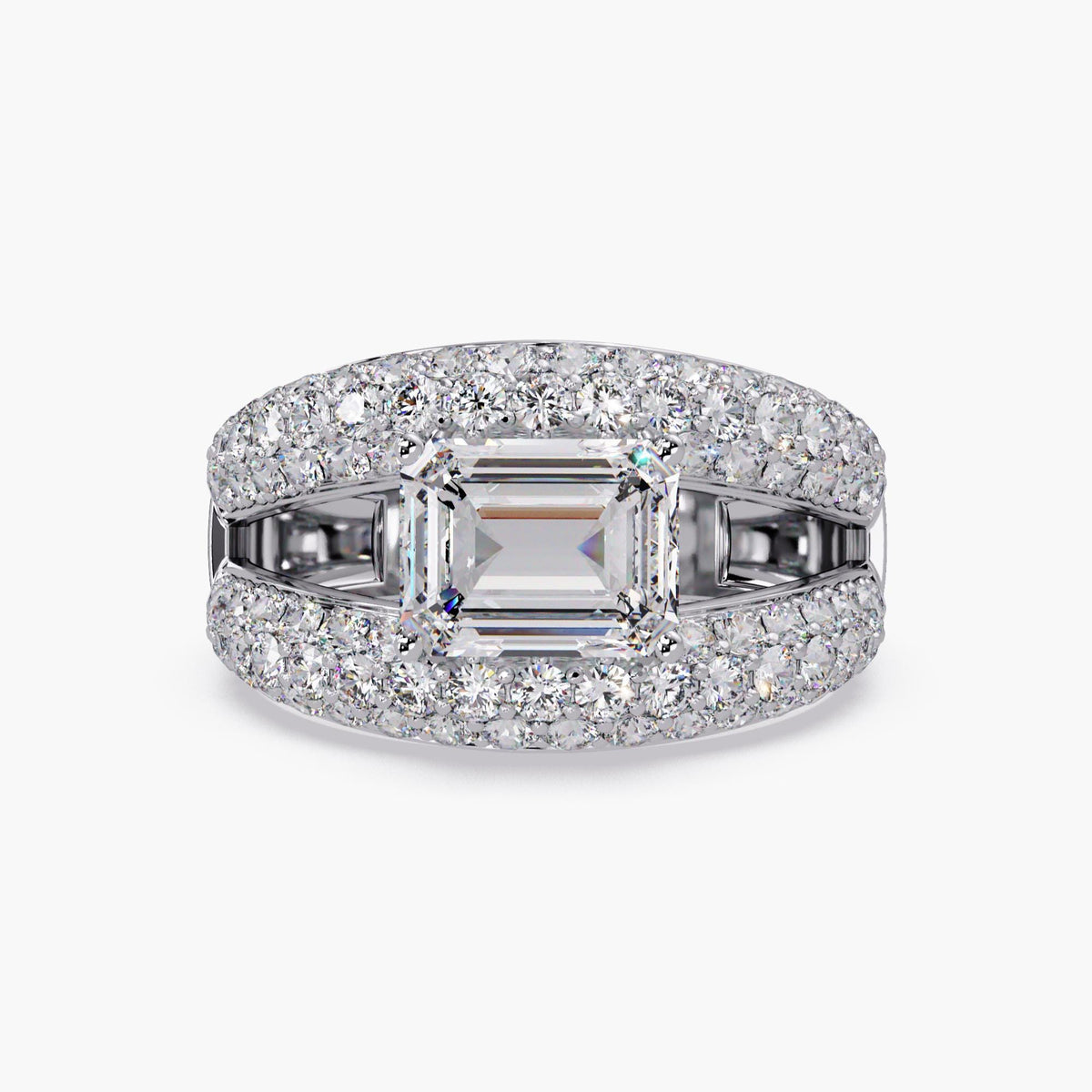 Front view of a 14k white gold dome statement ring featuring an east-west emerald-cut lab-grown diamond with pavé-set round diamonds and open side gaps.
