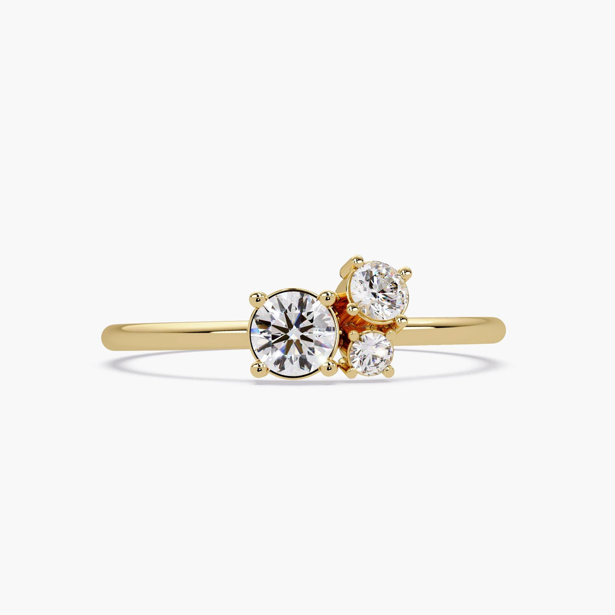 14k gold three-stone lab diamond ring with a dainty graduated cluster design, featuring round brilliant-cut diamonds in a slim prong setting