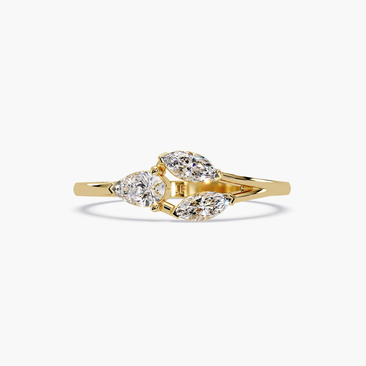 Floral-inspired diamond ring in 14K yellow gold featuring one pear and two marquise lab-grown diamonds arranged in a petal-like open design. The three stones are prong-set on a gently curved gold band