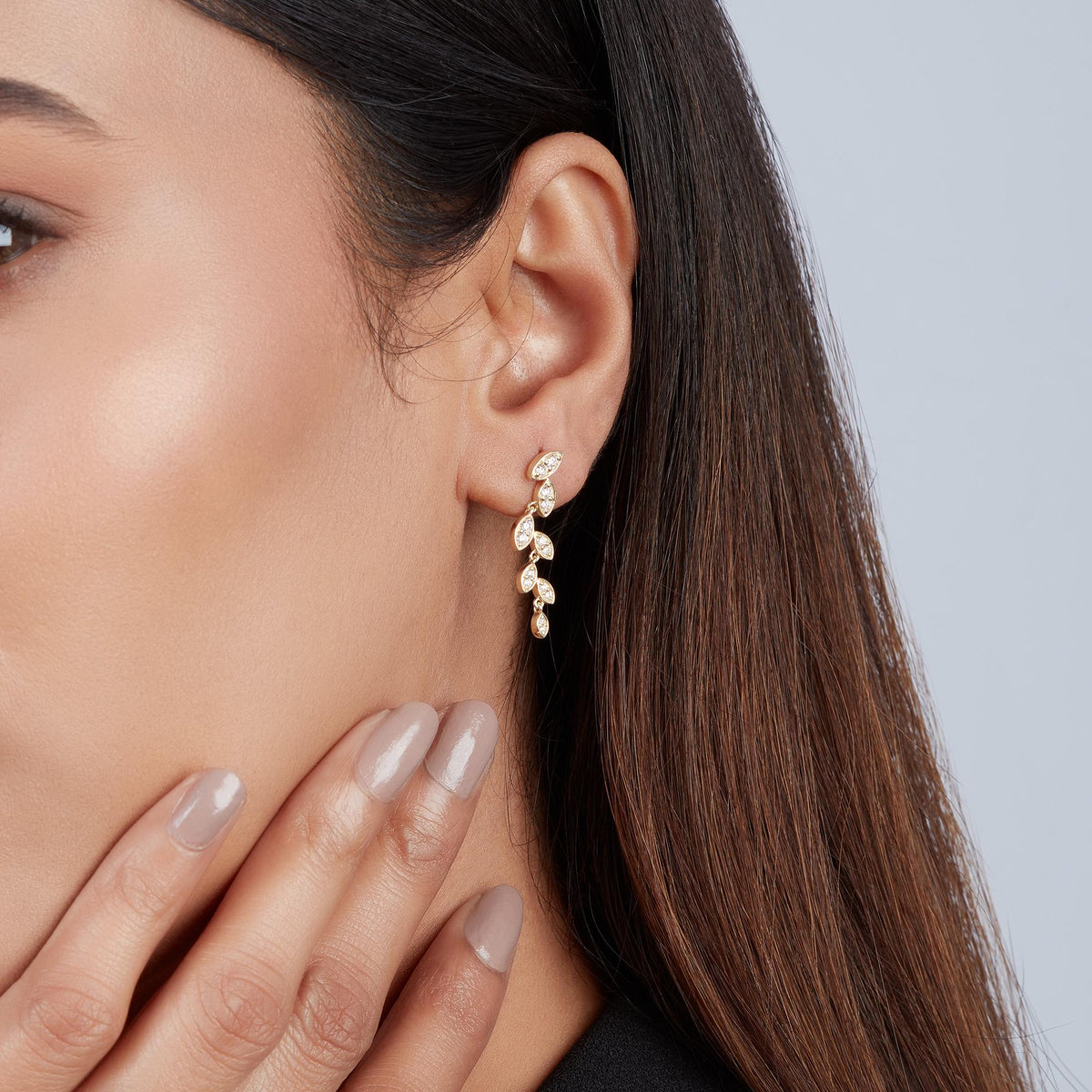 Gold diamond drop earrings perfect for weddings, anniversaries, and elegant dinners.