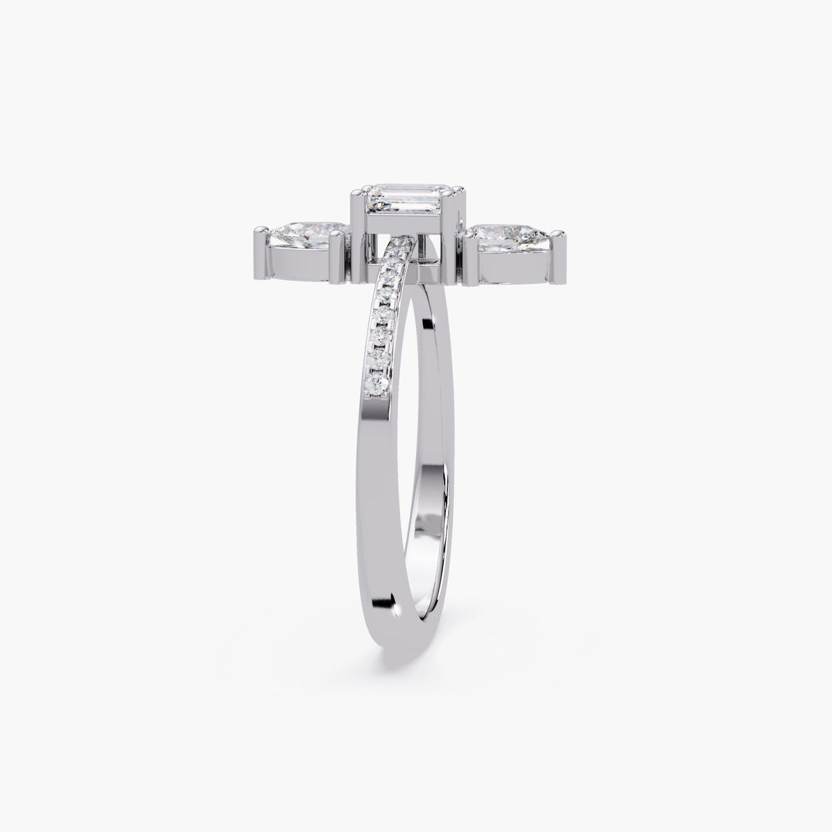 White gold lab diamond ring with emerald and pear stones, top view