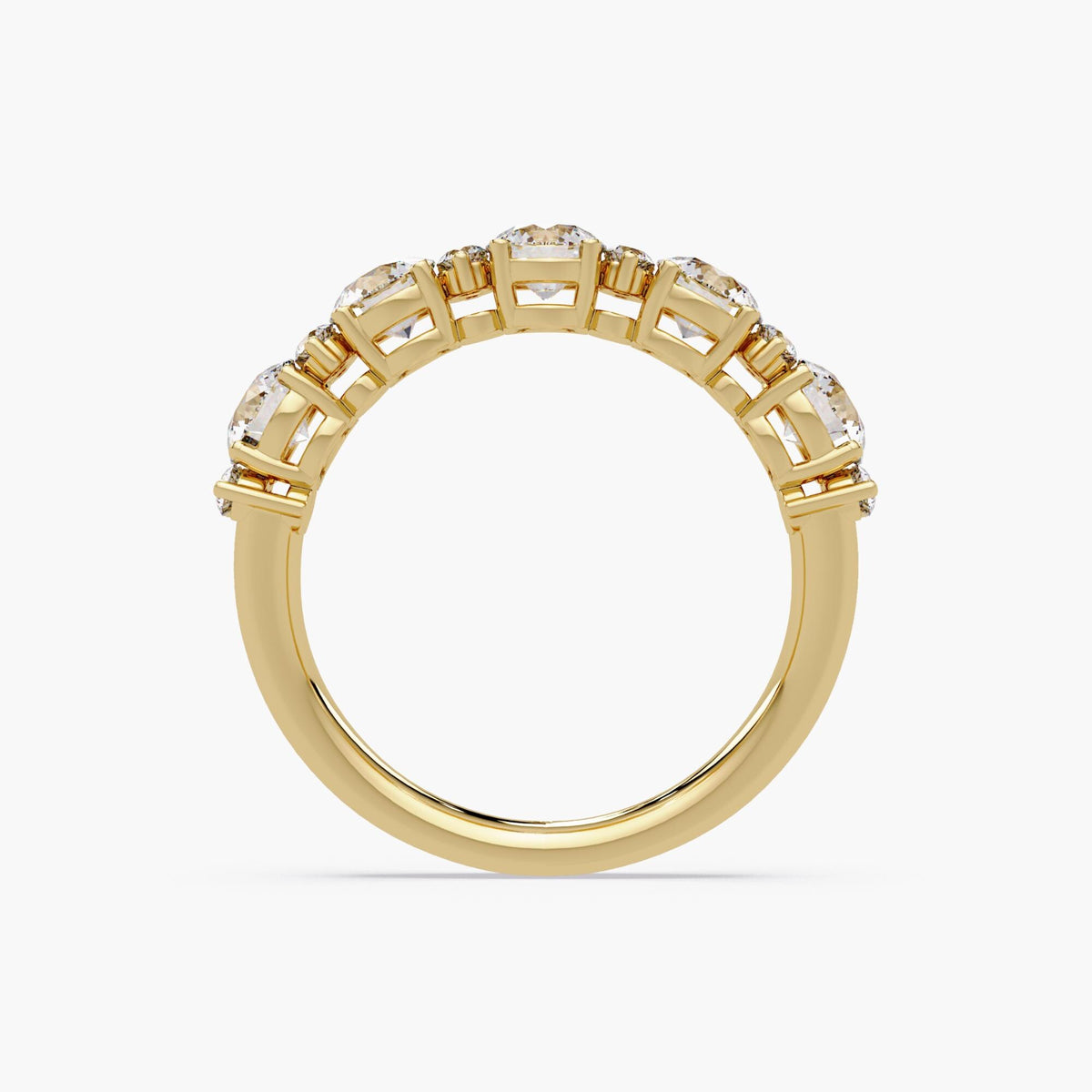 14K yellow gold round diamond band featuring five 4mm diamonds with accent stones in a prong setting.