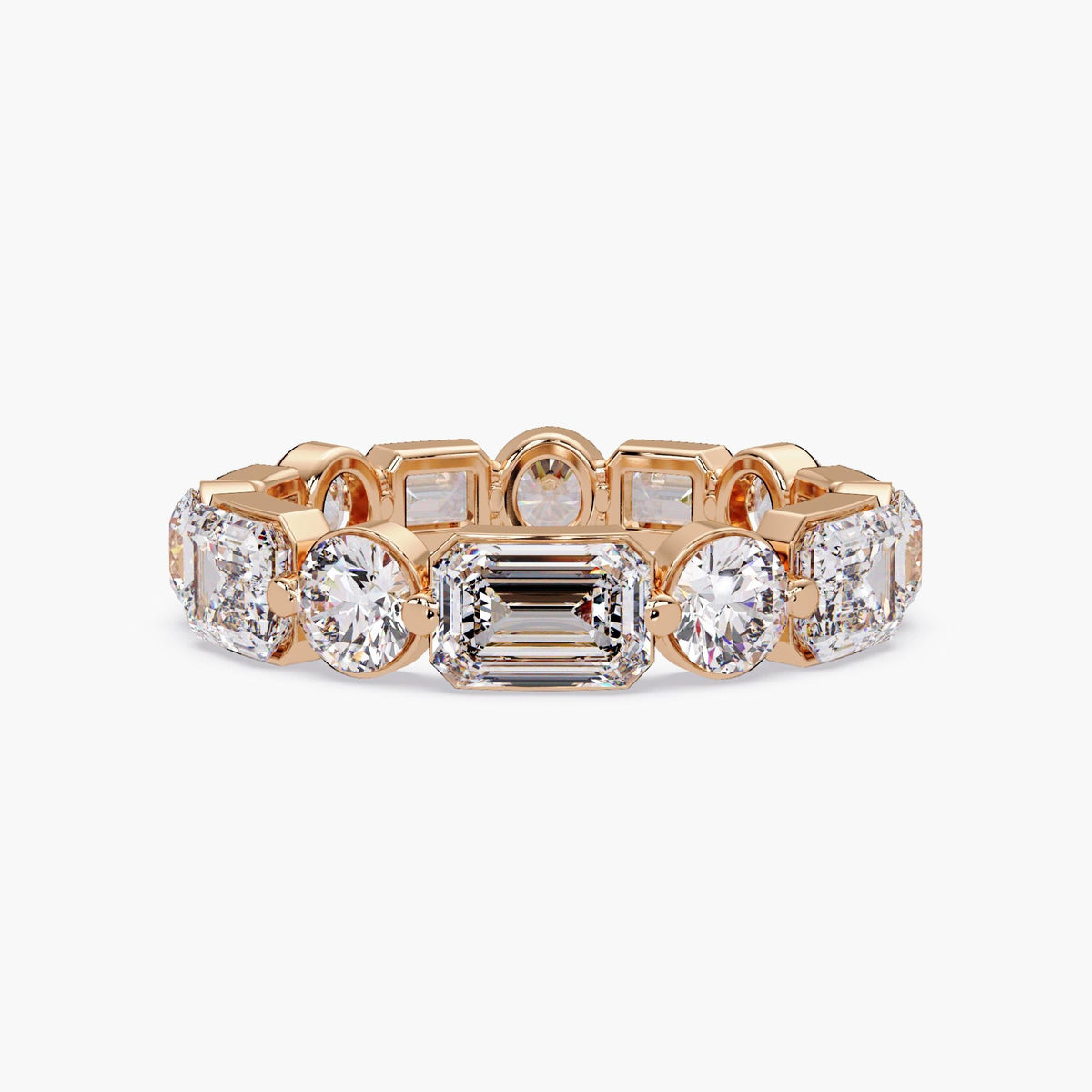14K rose gold tapered eternity band with lab grown emerald and round diamonds