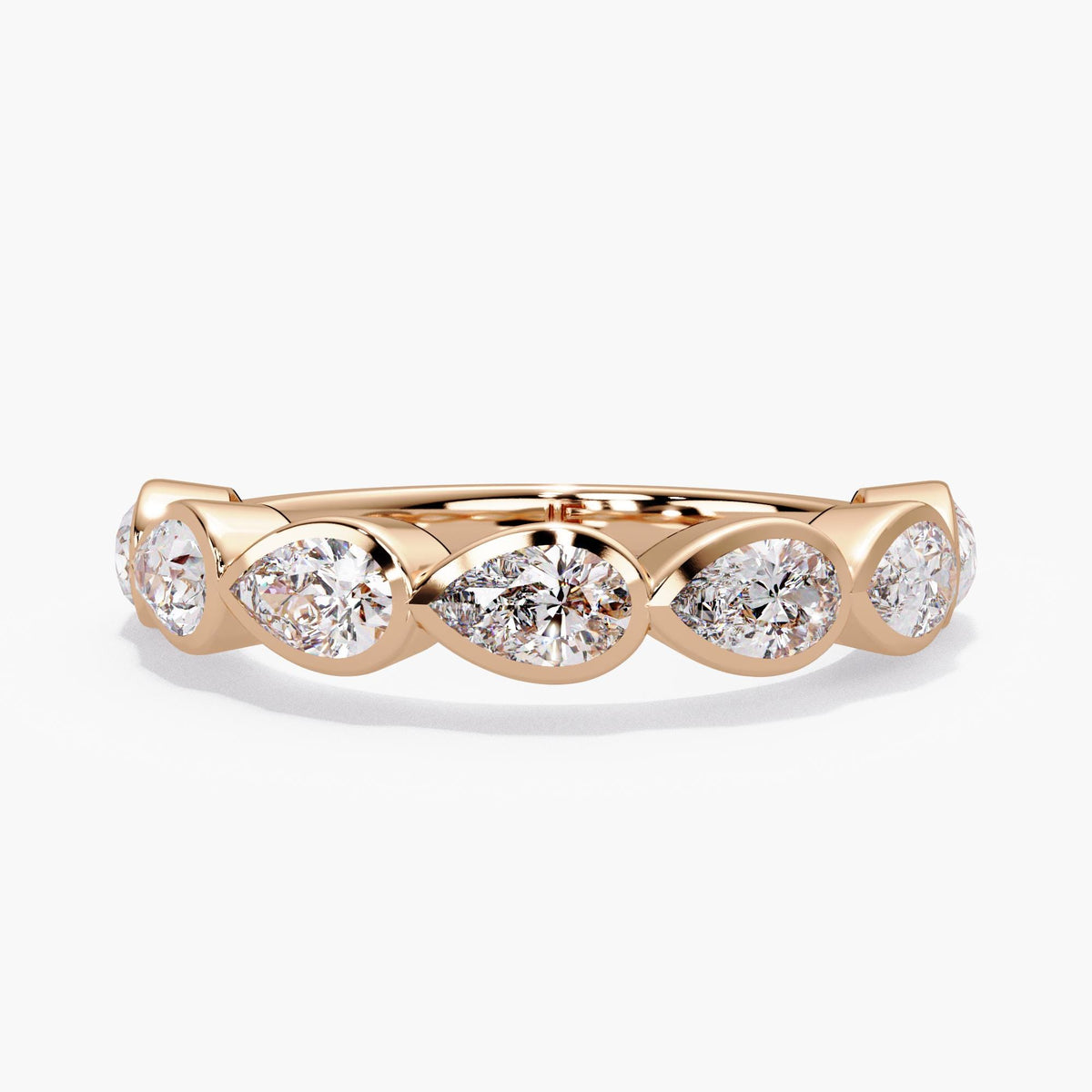 14K rose gold pear diamond bezel band with seven 5x3mm lab-grown diamonds set east-west in a 4mm half-eternity design.