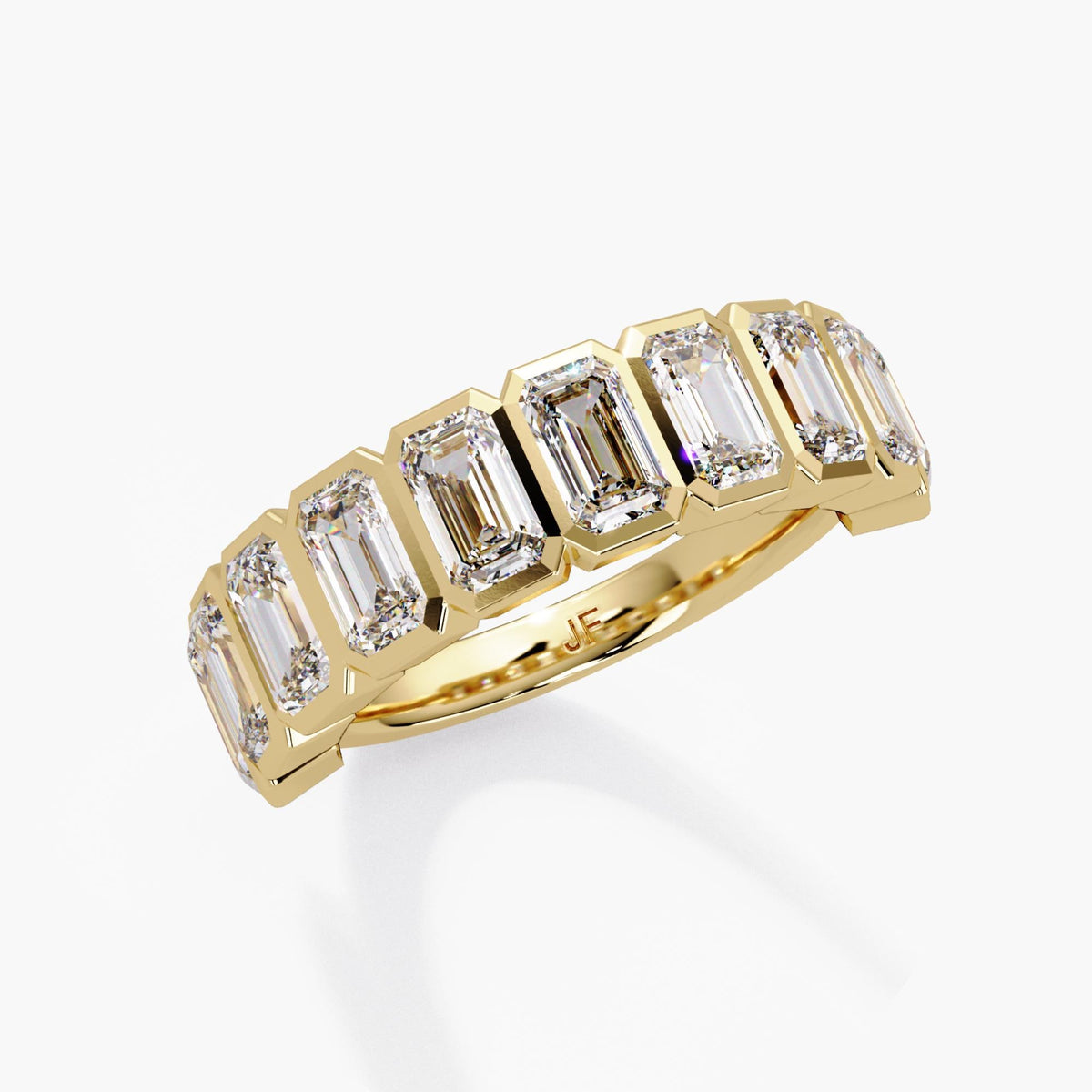 A sculptural emerald-cut diamond band designed to stand out with clean geometry and exceptional sparkle.
This 2.5+ CTW bezel-set half-eternity ring features ten 5×3 mm emerald-cut lab diamonds, each framed in a sleek, modern bezel for secure everyday wear.
Perfect as a wedding band, anniversary band, right-hand ring, or a bold stacking piece.