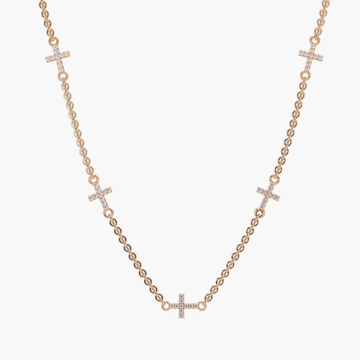 14K rose gold diamond sideways cross necklace with five pavé-set natural diamond crosses on a delicate cable chain