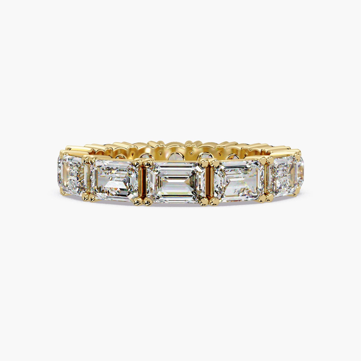 14K yellow gold eternity band featuring half emerald-cut and half round lab-grown diamonds in a full-eternity prong setting.