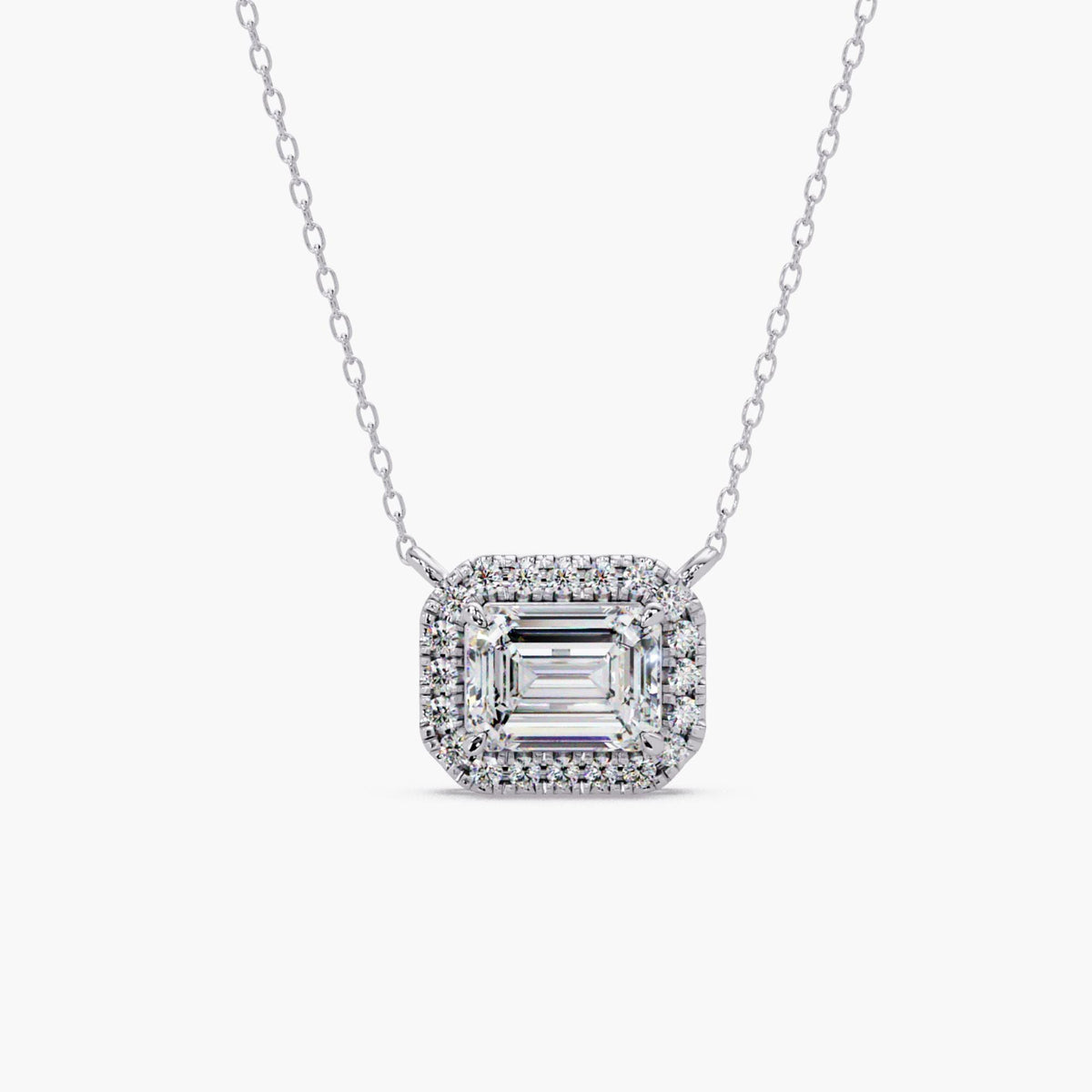 Emerald cut lab diamond halo necklace in 14K white gold featuring 1.75 CT IGI certified center diamond and round halo diamonds