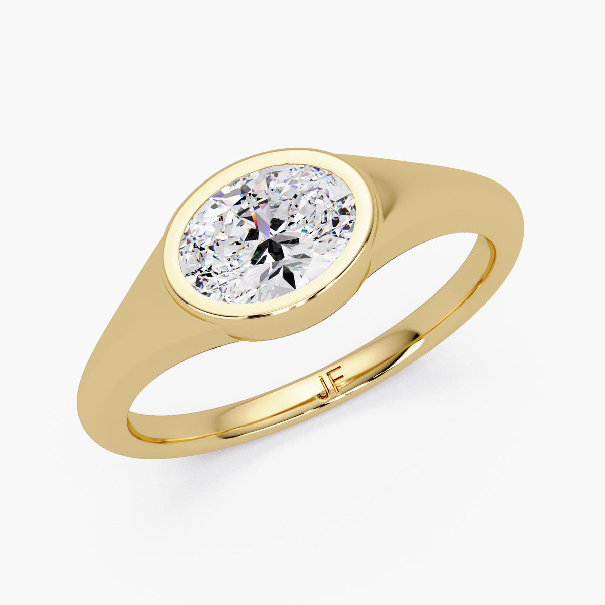 14K yellow gold oval bezel lab diamond ring with a smooth signet style band, a minimalist oval solitaire ring for everyday wear, stacking, a promise ring, or a modern engagement ring.