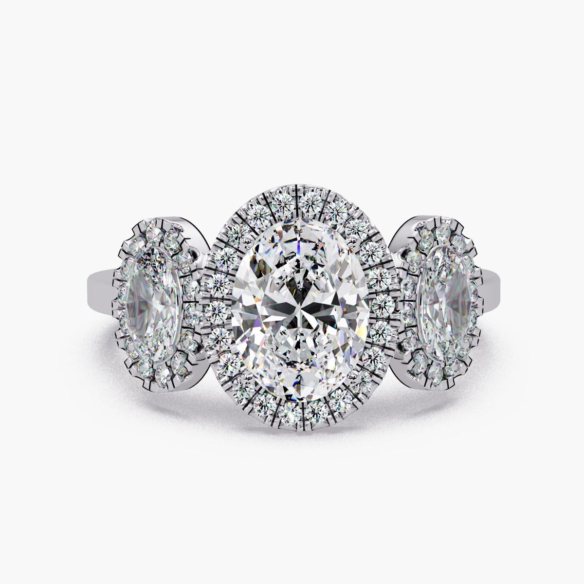 14K white gold oval lab grown diamond 3 stone halo engagement ring with IGI certified 1CT center oval, oval side stones, and pavé round diamond halos, 1.75 CTW trilogy statement ring