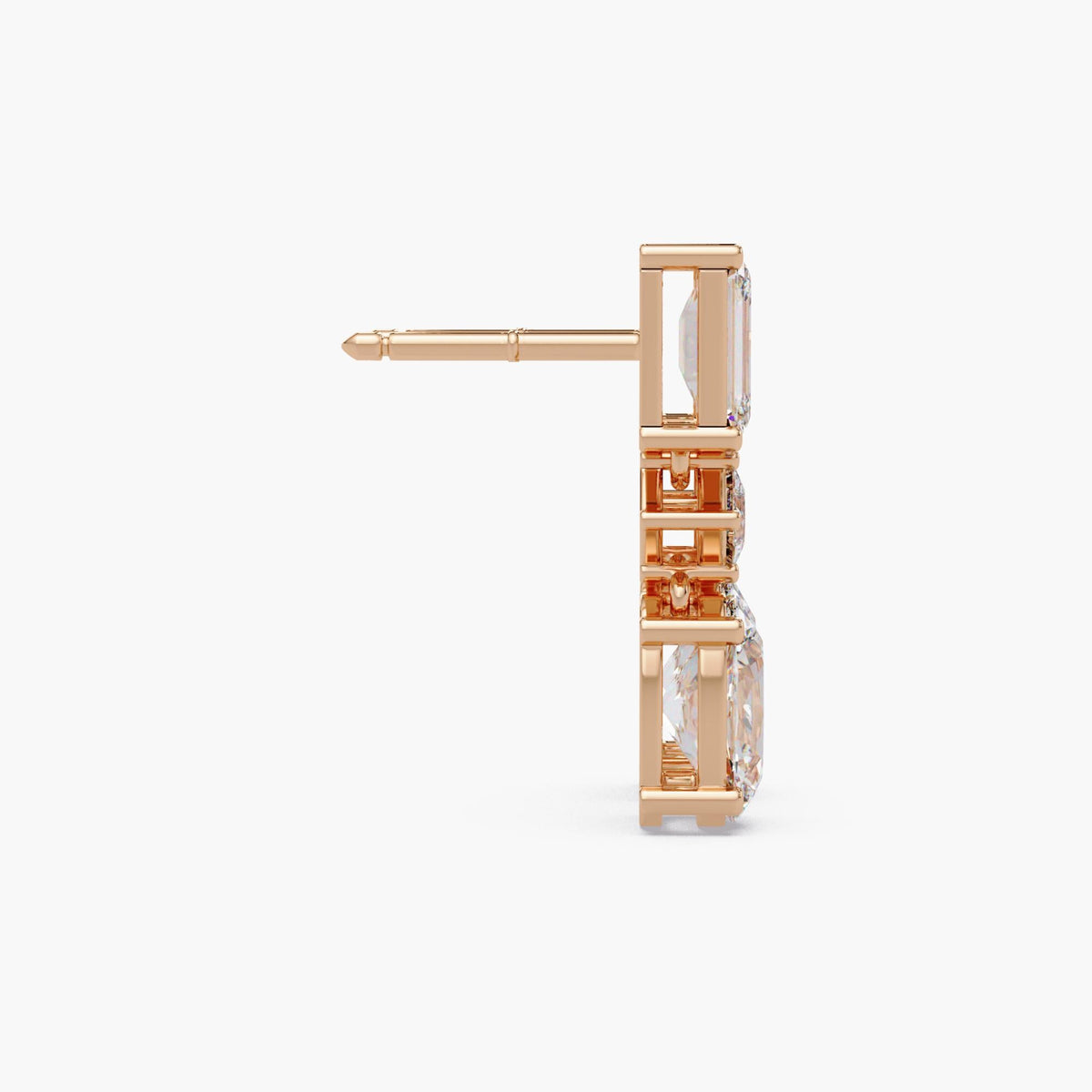 Oval and emerald cut lab grown diamond drop earrings in 14K gold, featuring a graduated three stone design with oval diamonds and emerald accents.