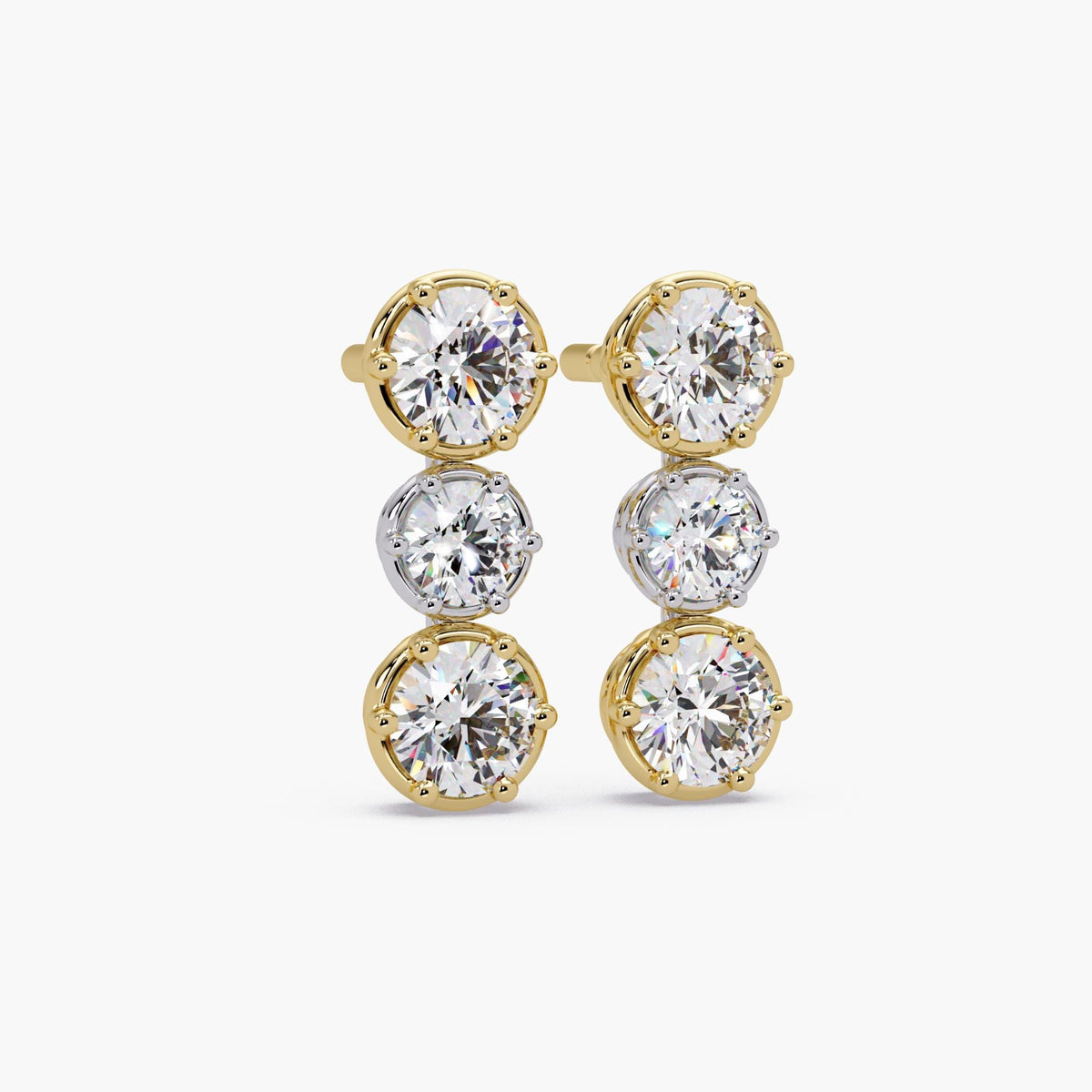 Vertical mixed metal diamond stud earrings with three round lab-grown diamonds in eight-prong crown settings, two-tone yellow and white gold