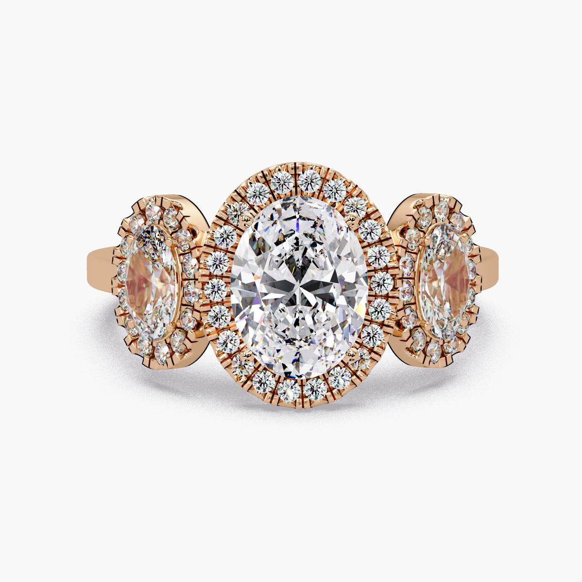 14K rose gold oval lab grown diamond 3 stone halo engagement ring with IGI certified 1CT center oval, oval side stones, and pavé round diamond halos, 1.75 CTW trilogy statement ring