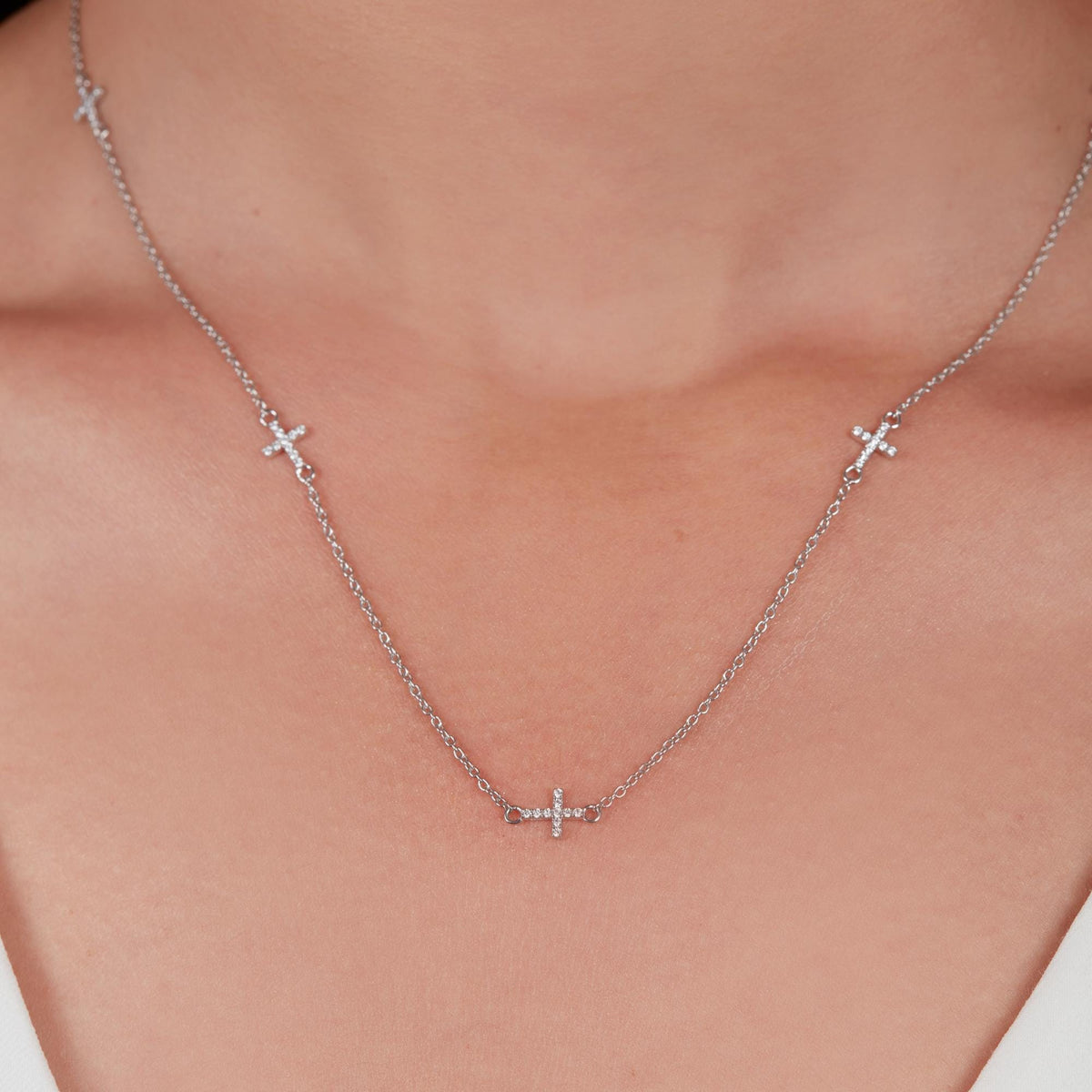 Lab grown diamond station necklace worn on collarbone in 14K white gold, minimalist everyday jewelry