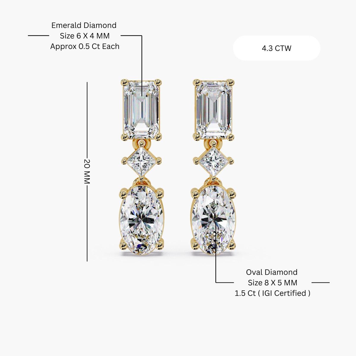 Oval and emerald cut lab grown diamond drop earrings in 14K gold, featuring a graduated three stone design with oval diamonds and emerald accents.