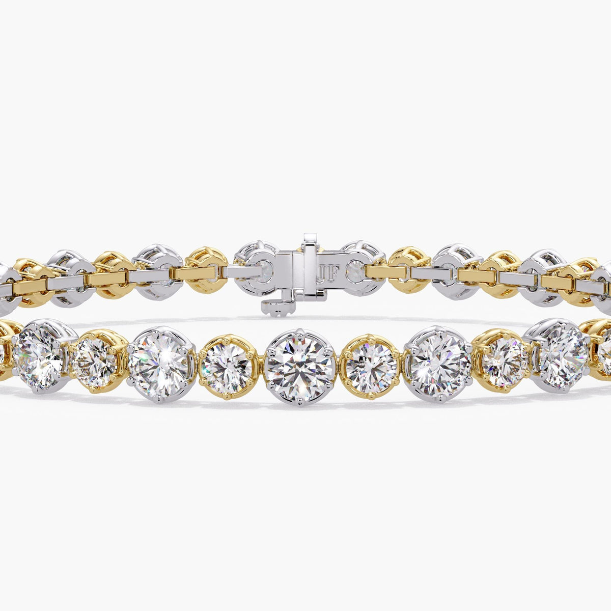 Alternating graduated lab diamond tennis bracelet showing 2.8mm and 3.5mm round diamonds in two tone 14K gold