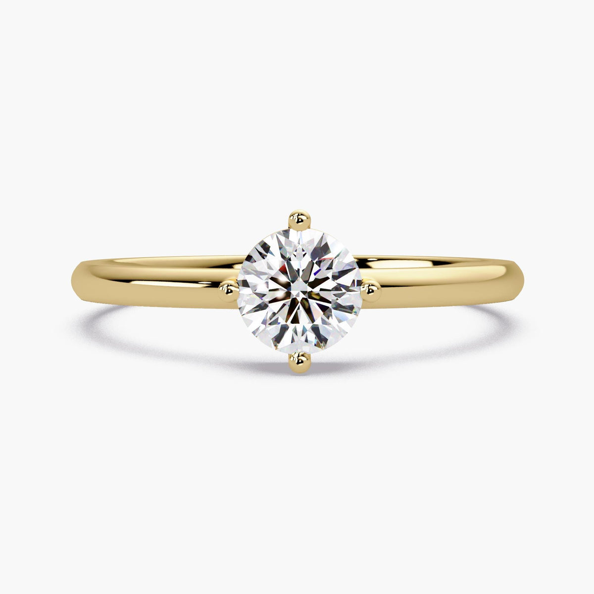 14K yellow gold solitaire ring featuring a 0.5 CTW round lab-grown diamond. The minimalist prong setting highlights the brilliant EF+ color and VS+ clarity, creating a timeless look of elegance. This ring is designed as a classic symbol of love, perfect for a traditional engagement.