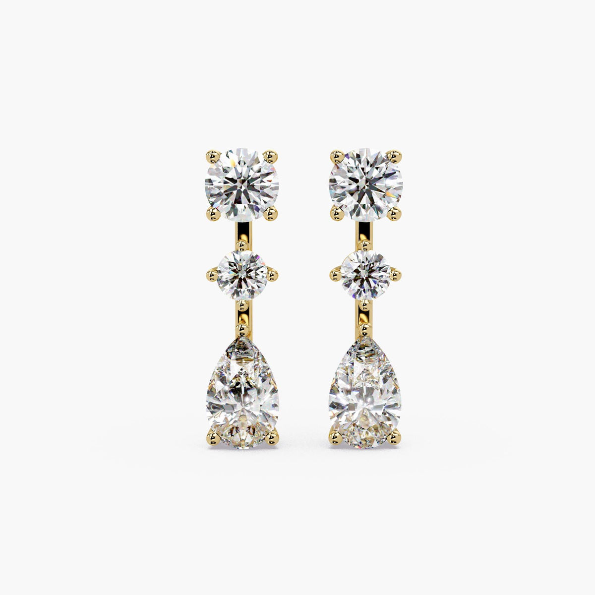 14K yellow gold lab grown diamond drop earrings, featuring round stud top, center round diamond, and pear-shaped diamond drop in three-stone vertical design, 2.75 CTW