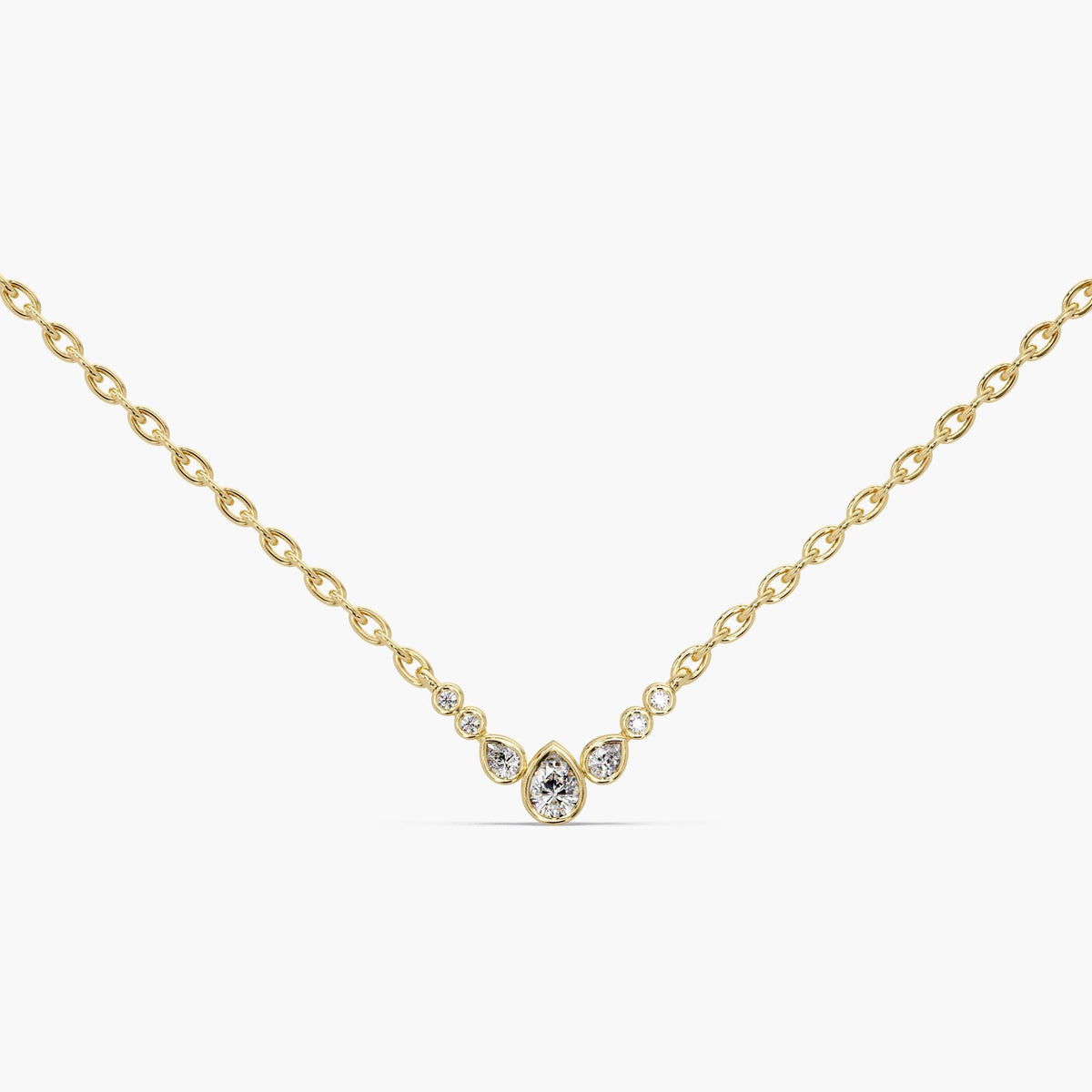 A dainty bubble diamond necklace crafted in solid 14K yellow gold. This pear cluster pendant features 0.20 CTW of lab diamonds on a 0.9 MM adjustable 16–18 inch chain. A minimal gold diamond necklace for everyday wear, layering, or a meaningful gift.