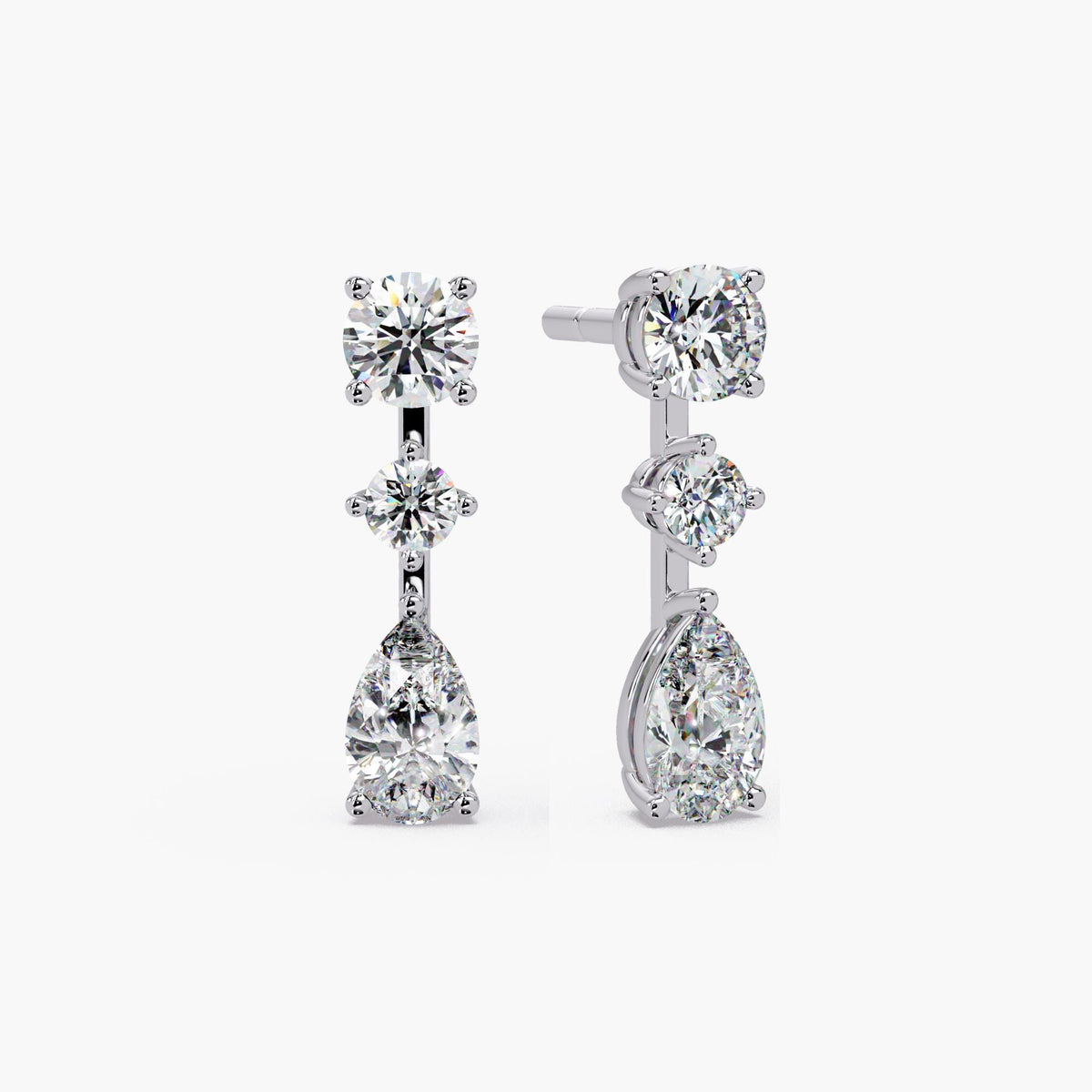 14K white gold lab grown diamond drop earrings featuring round stud top, center round diamond, and pear-shaped diamond drop in prong setting, three-stone vertical design, 2.75 CTW
