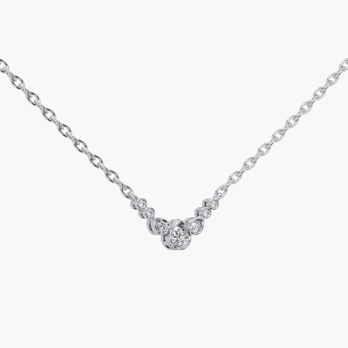 A dainty bubble diamond necklace crafted in solid 14K white gold. This pear cluster pendant features 0.20 CTW of lab diamonds on a 0.9 MM adjustable 16–18 inch chain. A minimal gold diamond necklace for everyday wear, layering, or a meaningful gift.