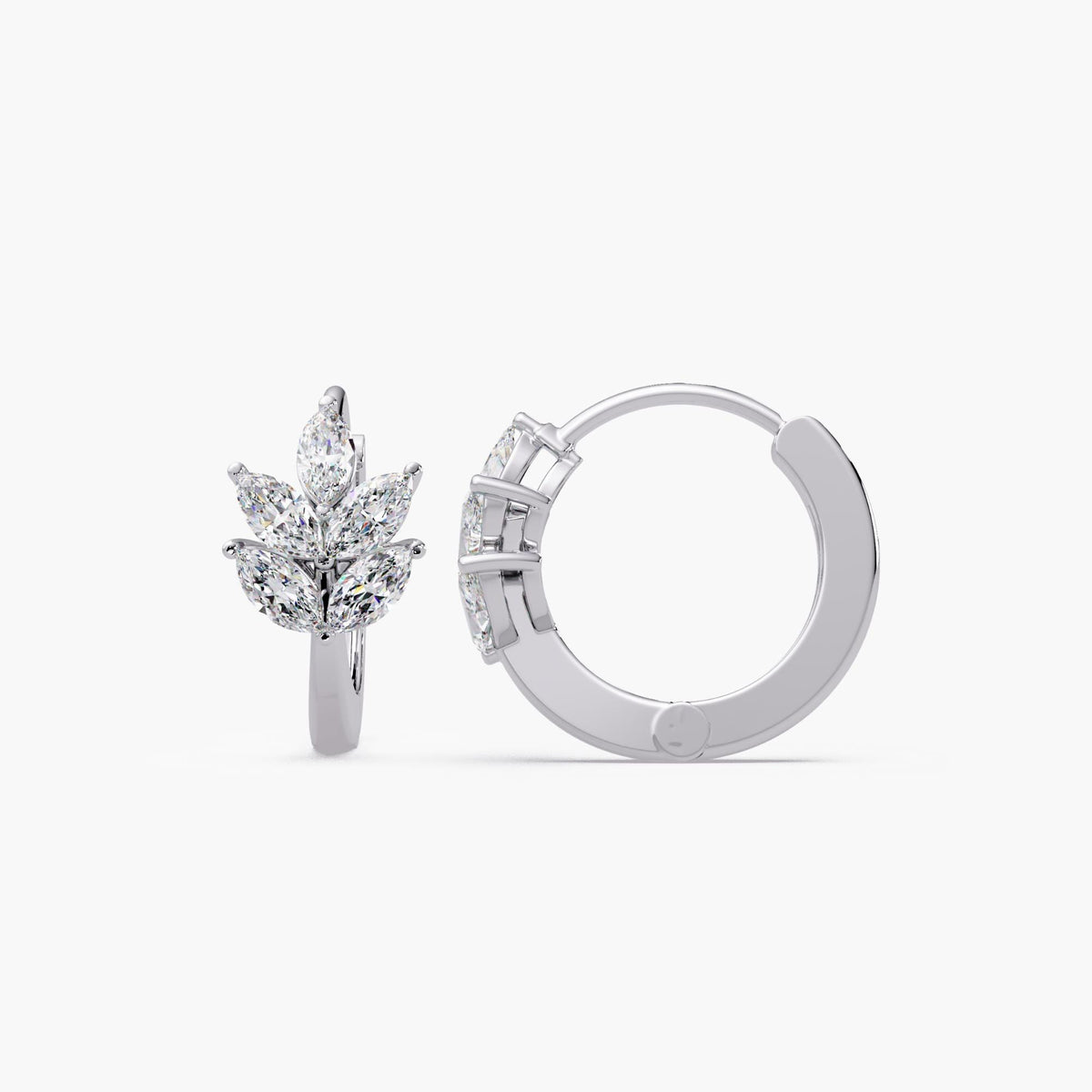 A pair of leaf huggie earrings crafted in solid 14K white gold, featuring marquise lab diamonds arranged in a leaf design cluster.
