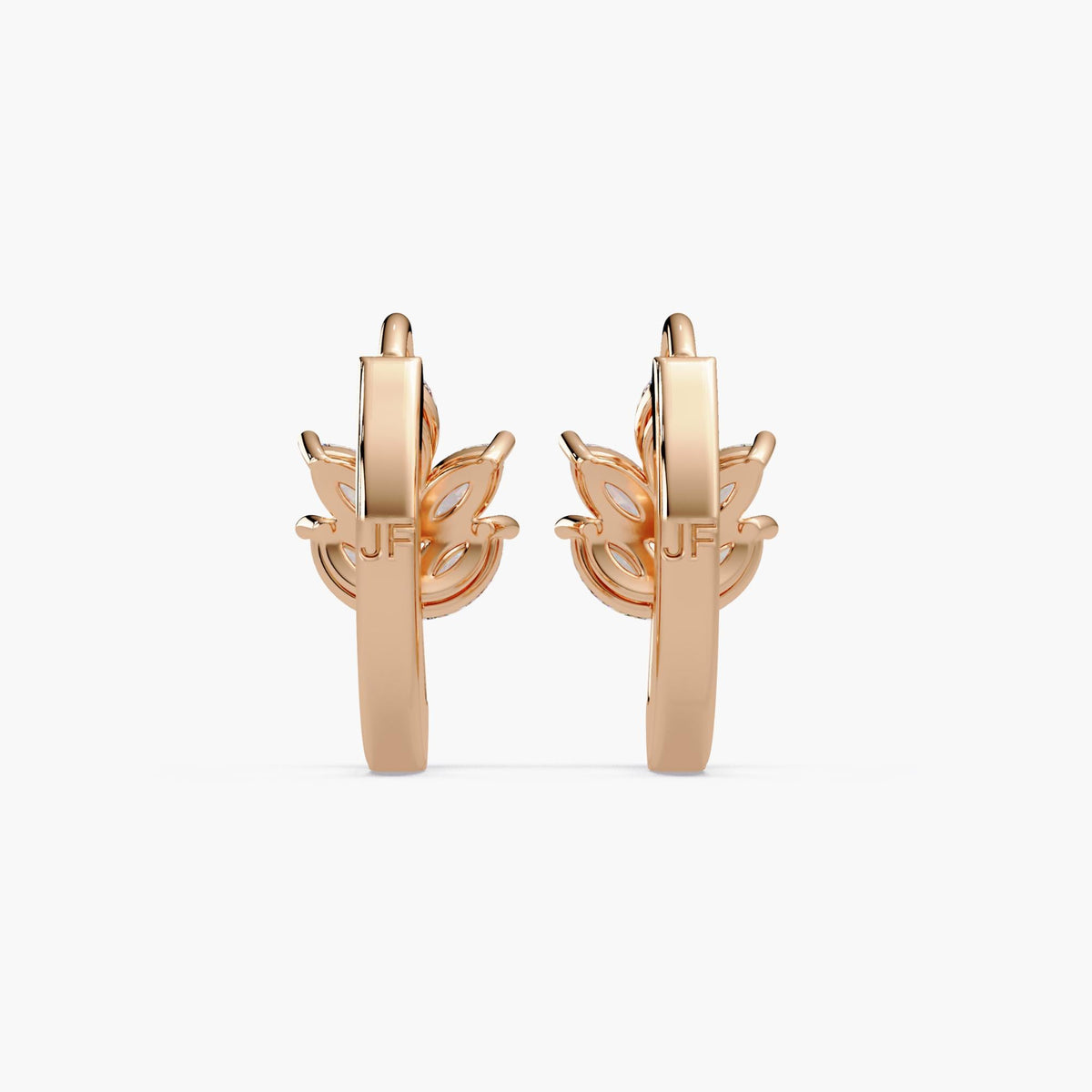 A pair of leaf huggie earrings crafted in solid 14K rose gold, featuring marquise lab diamonds arranged in a leaf design cluster.