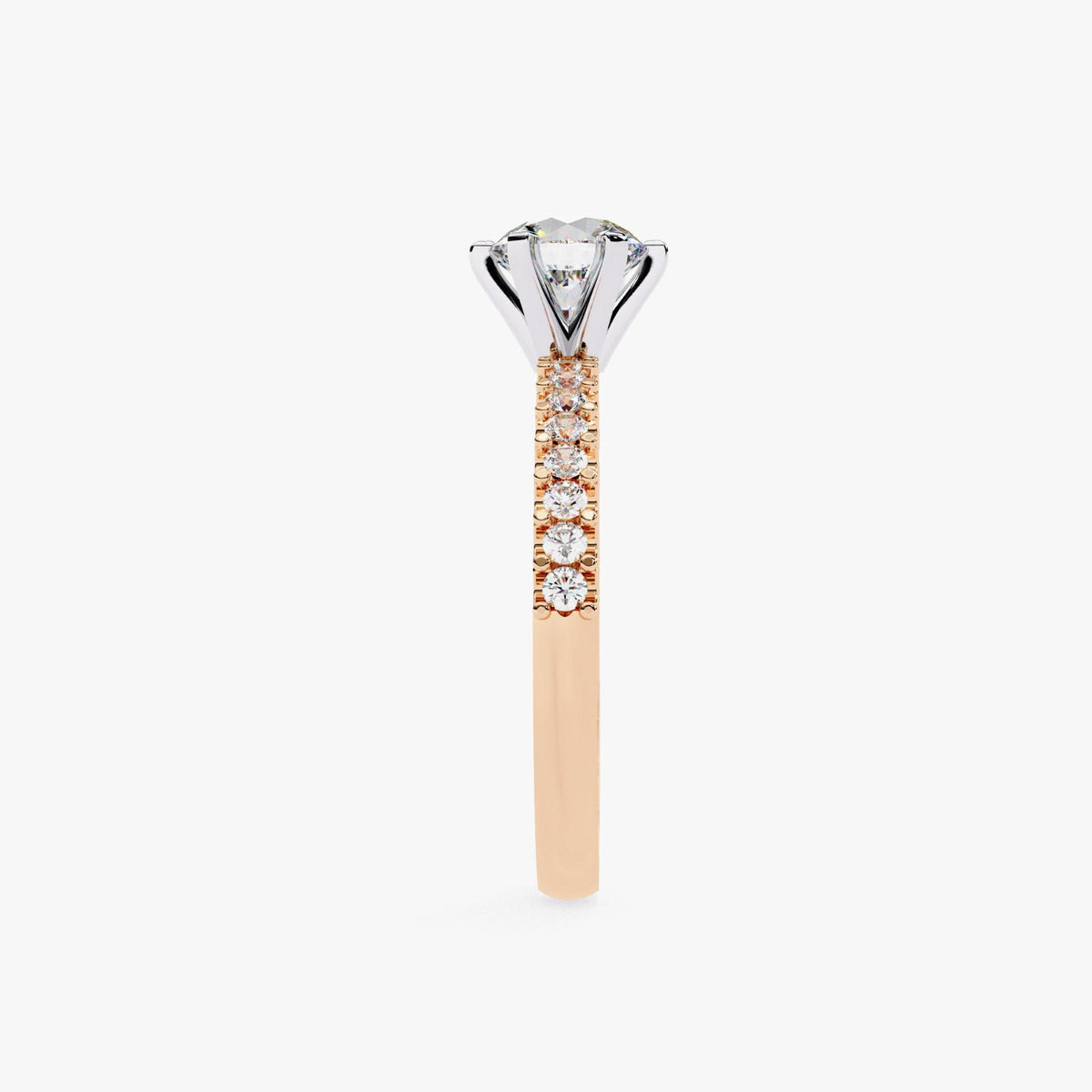 A close-up view of a diamond engagement ring with a large central diamond surrounded by smaller diamonds set in a gold band.