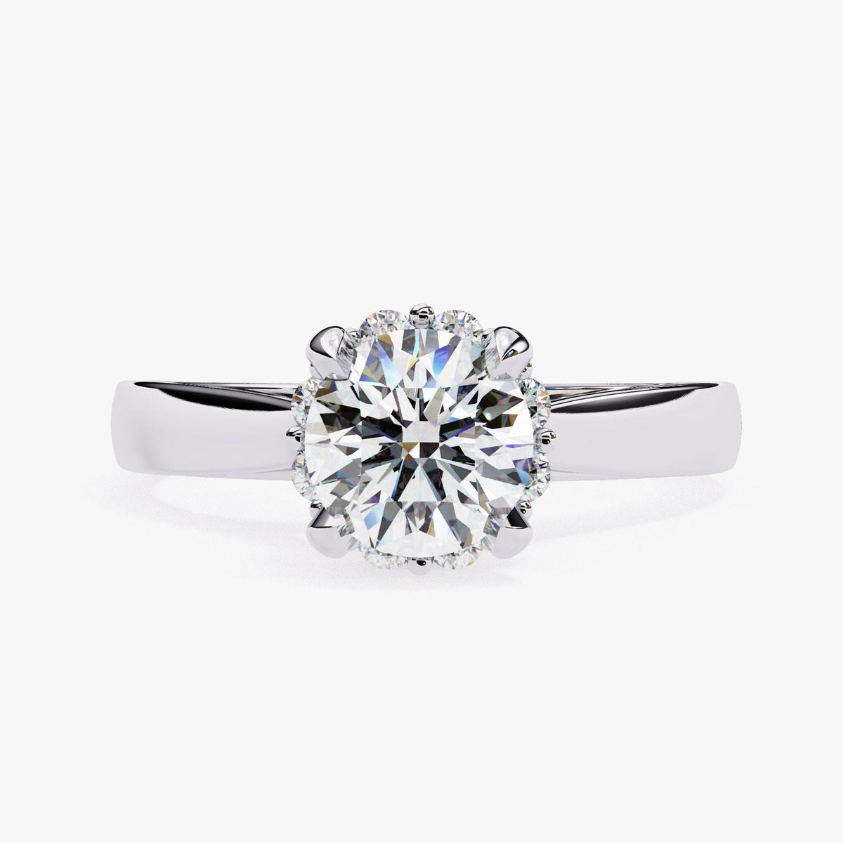A close-up of a diamond engagement ring with a large, brilliant-cut diamond set in a halo of smaller diamonds.