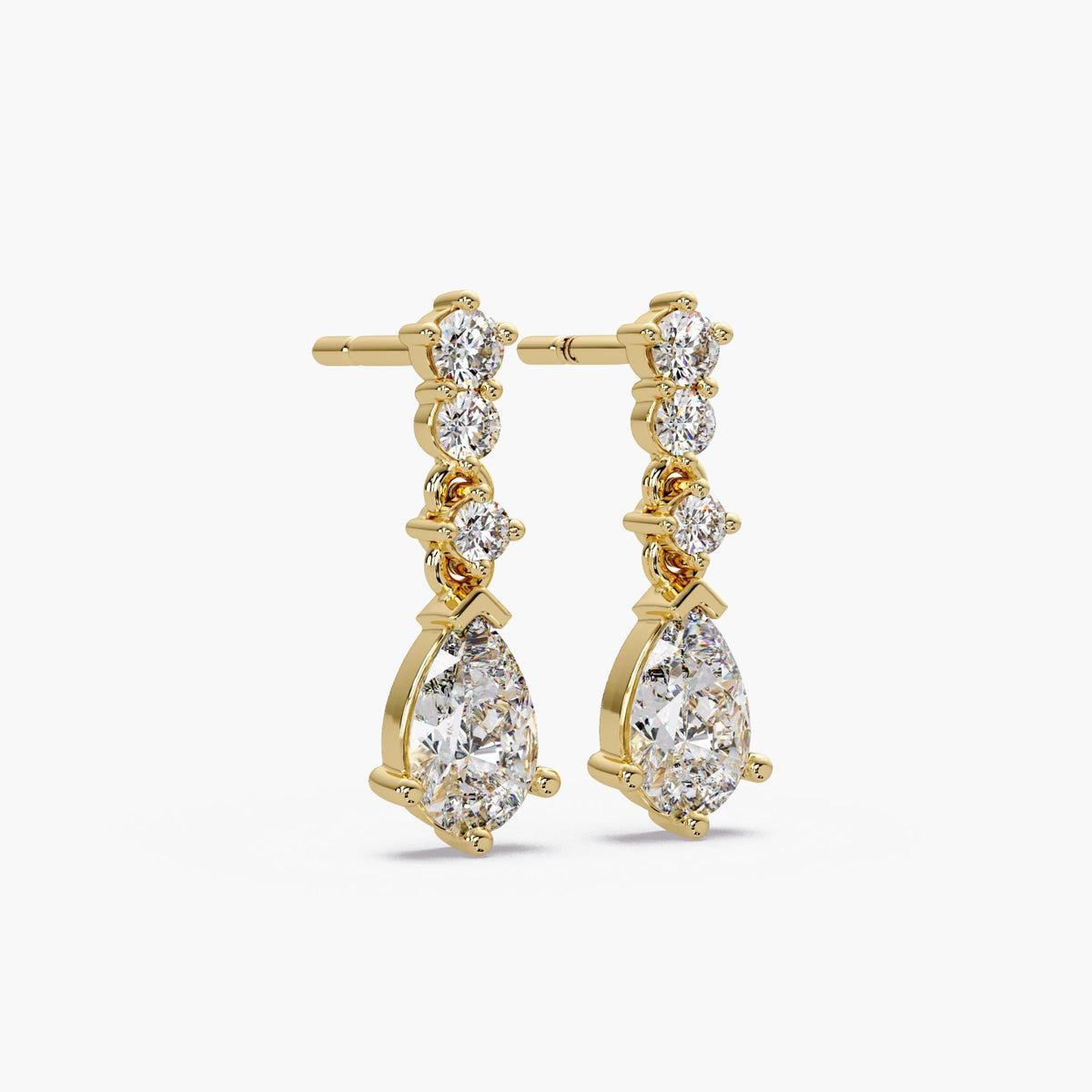 14k yellow gold pear diamond earrings in ear / second piercing diamond earrings / low sitting diamond earrings / dainty diamond drop earrings / everyday luxury earrings / teardrop diamond drops