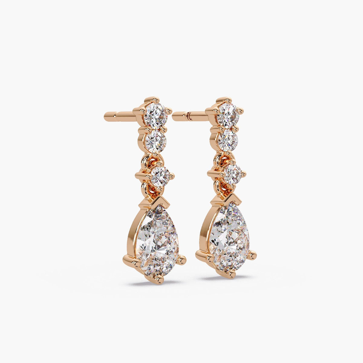 pear shaped diamond drop earrings / lab grown pear diamond earrings / statement diamond drop earrings / white gold diamond earrings / yellow gold diamond earrings / rose gold diamond earrings