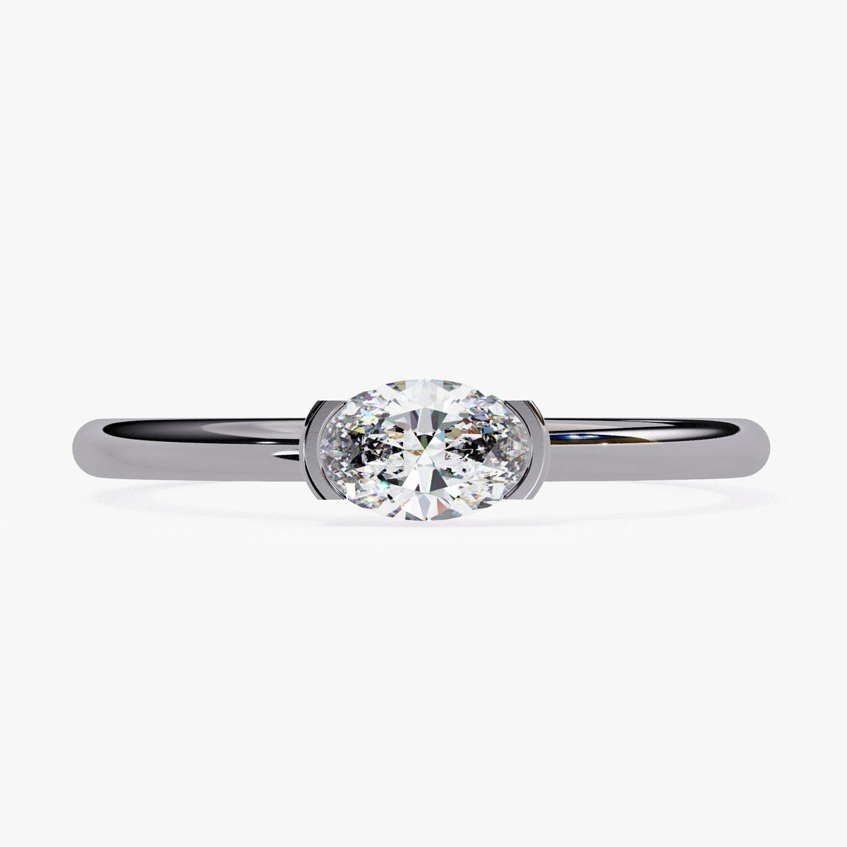 A silver ring with a large oval-shaped diamond set in the center.