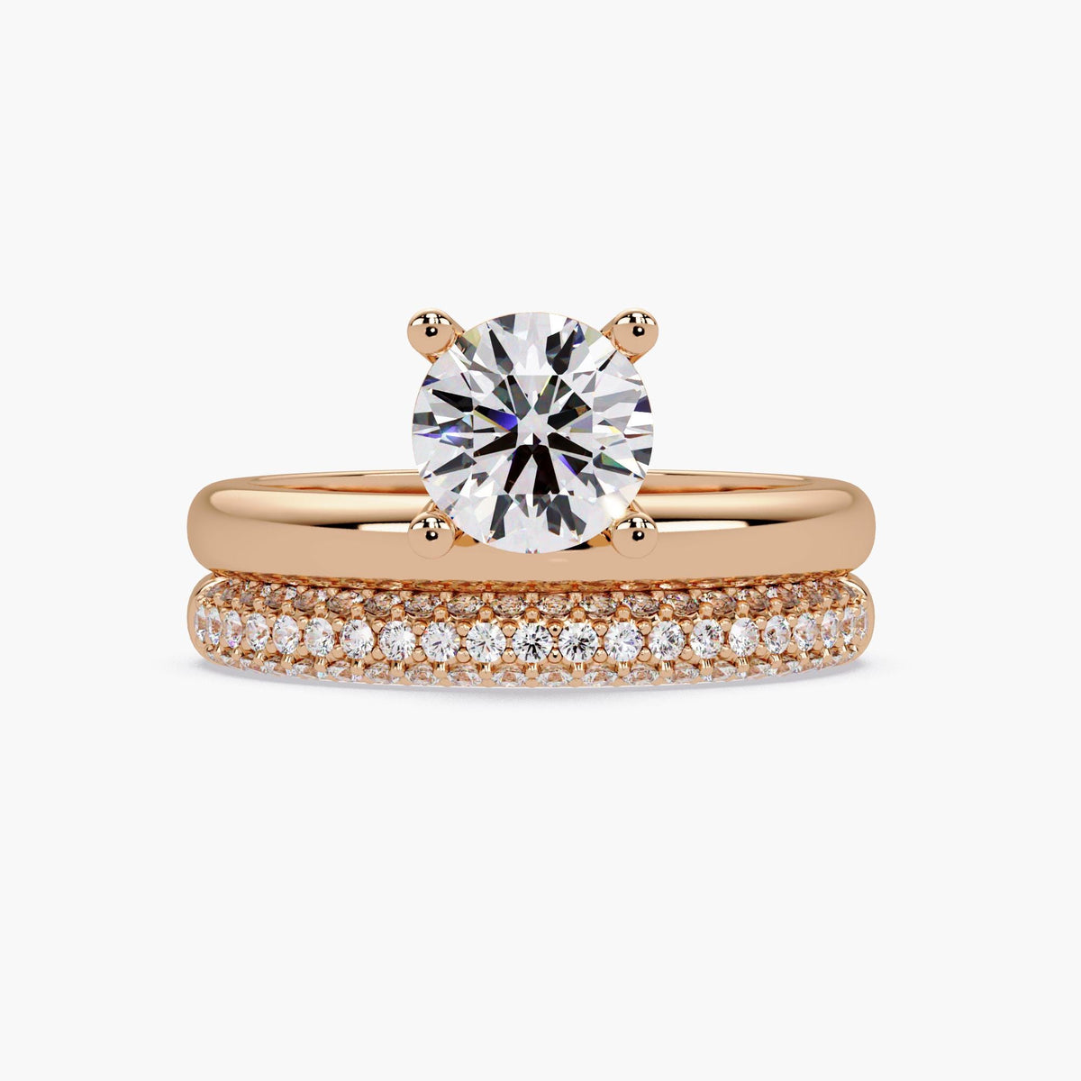 Round lab grown diamond engagement ring set in 14K rose gold with matching wedding band