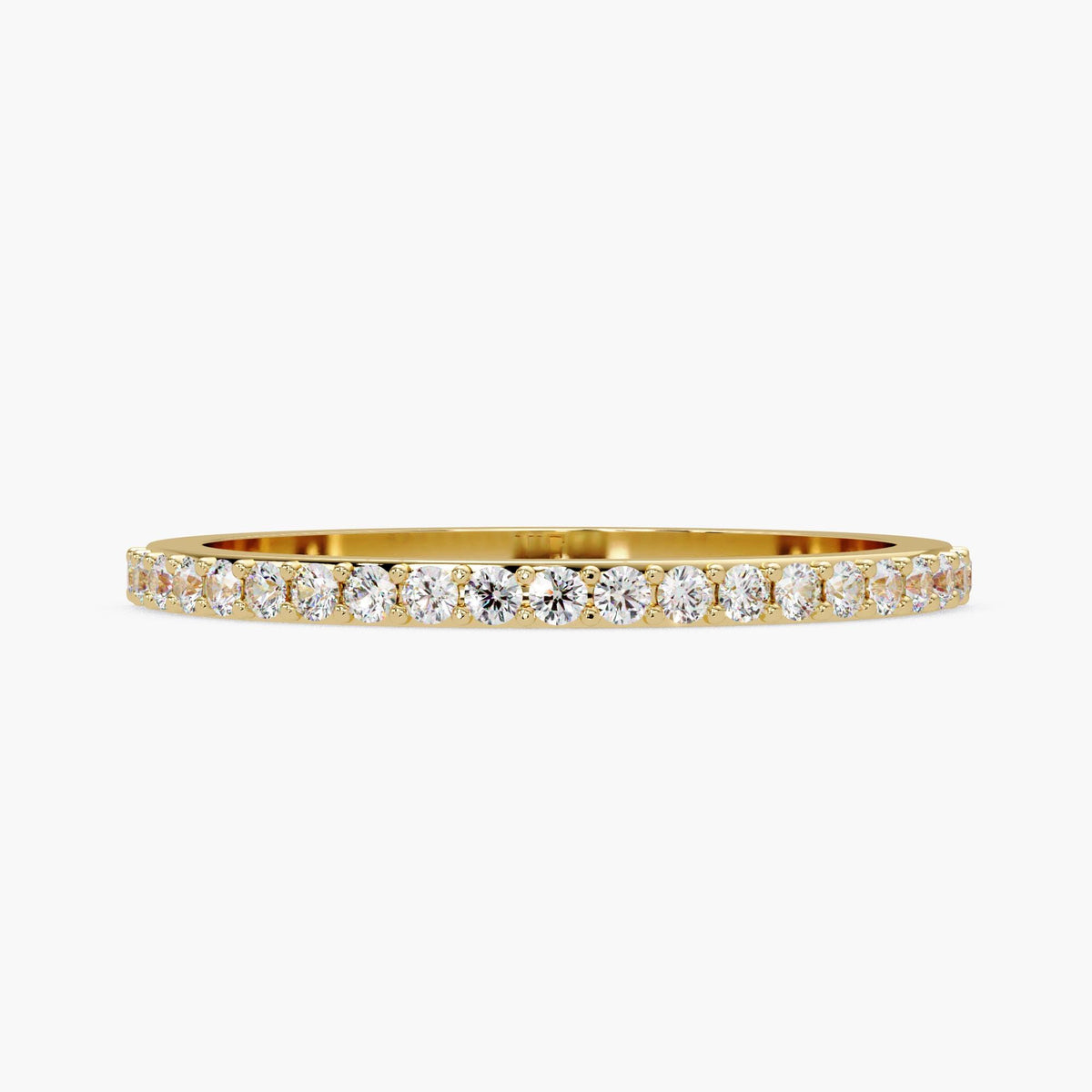 A gold band with a row of diamonds set in it.