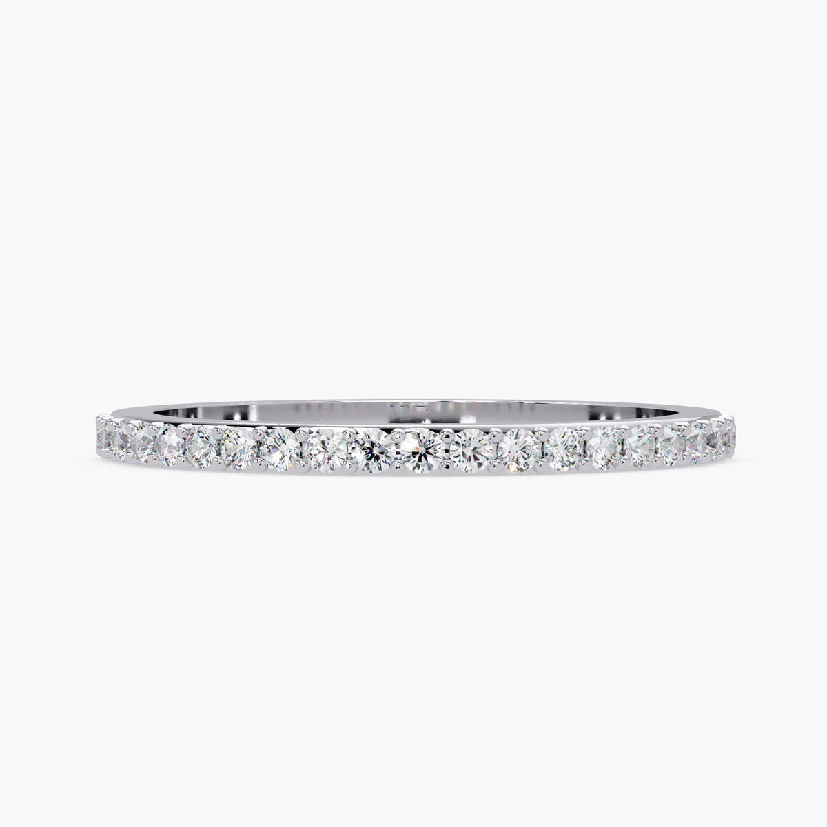 A simple silver band with a row of small diamonds set in it.