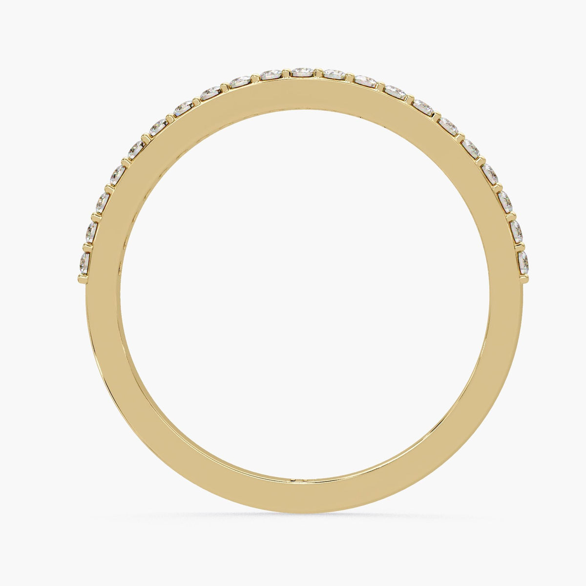 A gold ring with a row of small diamonds along the edge.
