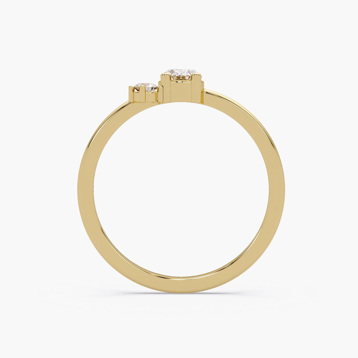 A gold ring with a central diamond and two smaller diamonds on either side.