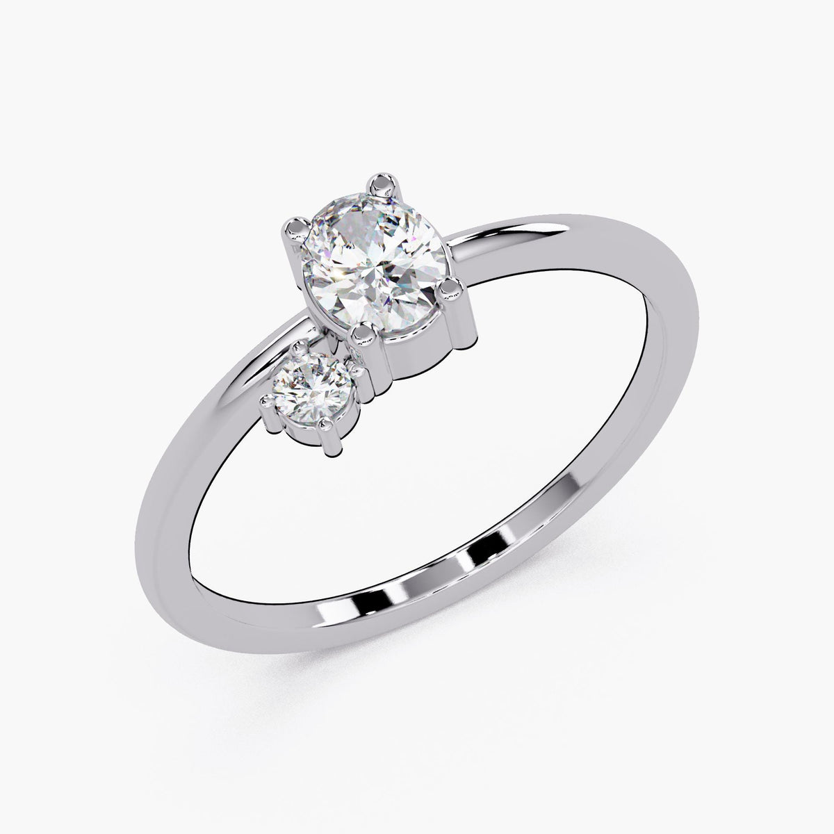 A silver ring with a large central diamond and two smaller diamonds on either side.