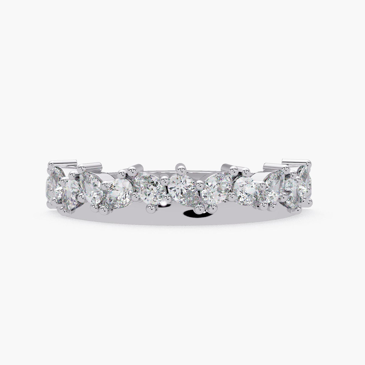 A silver ring with a row of large, clear diamonds set in a band.