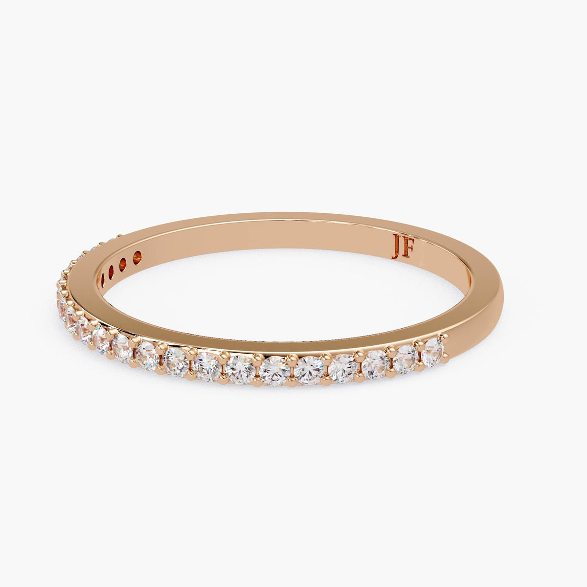 A gold ring with a row of small diamonds set in the band.