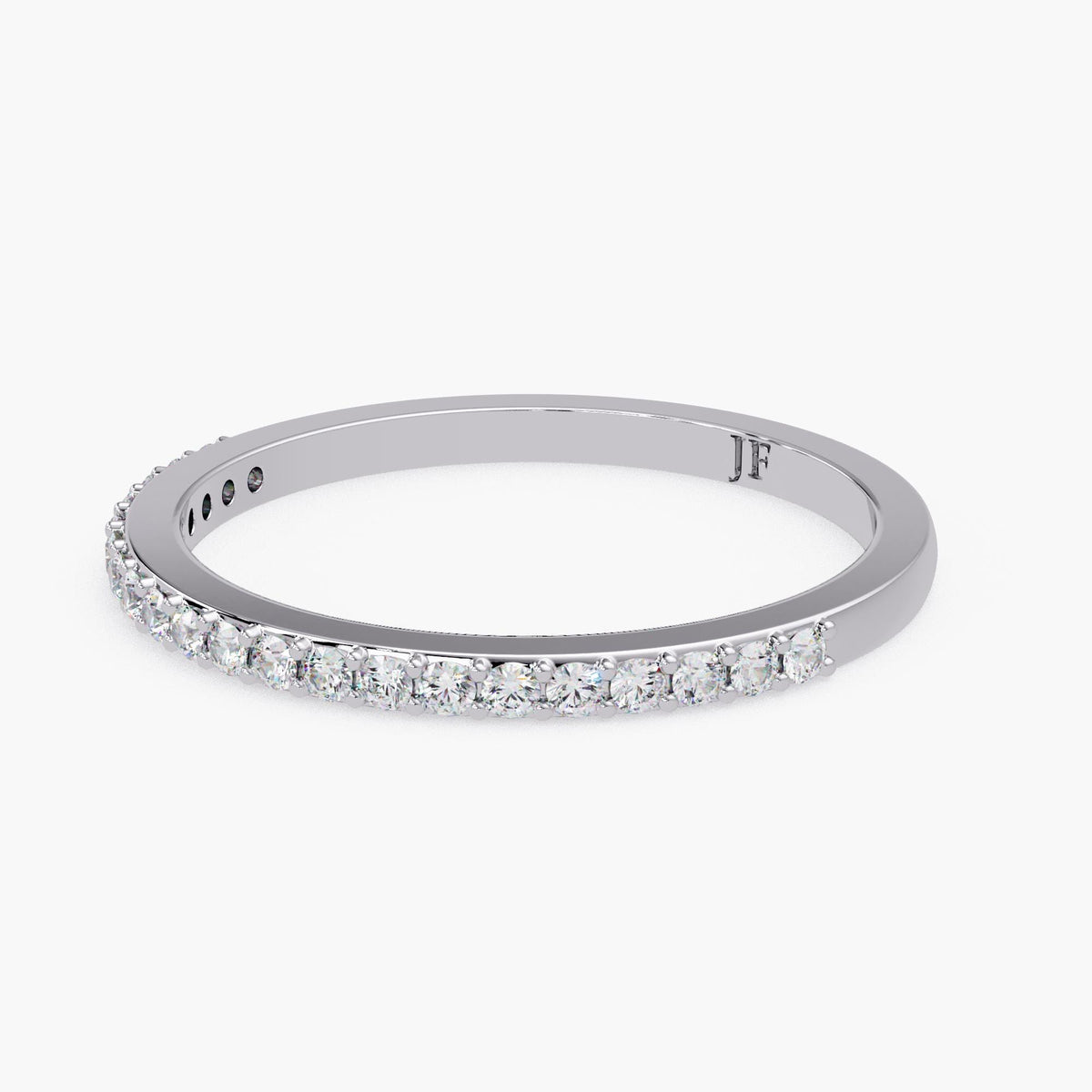 A silver band ring with a row of small diamonds set in it.