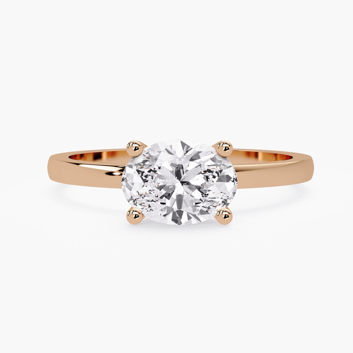 14K rose gold engagement ring with 1 CT oval lab grown diamond and four prong solitaire