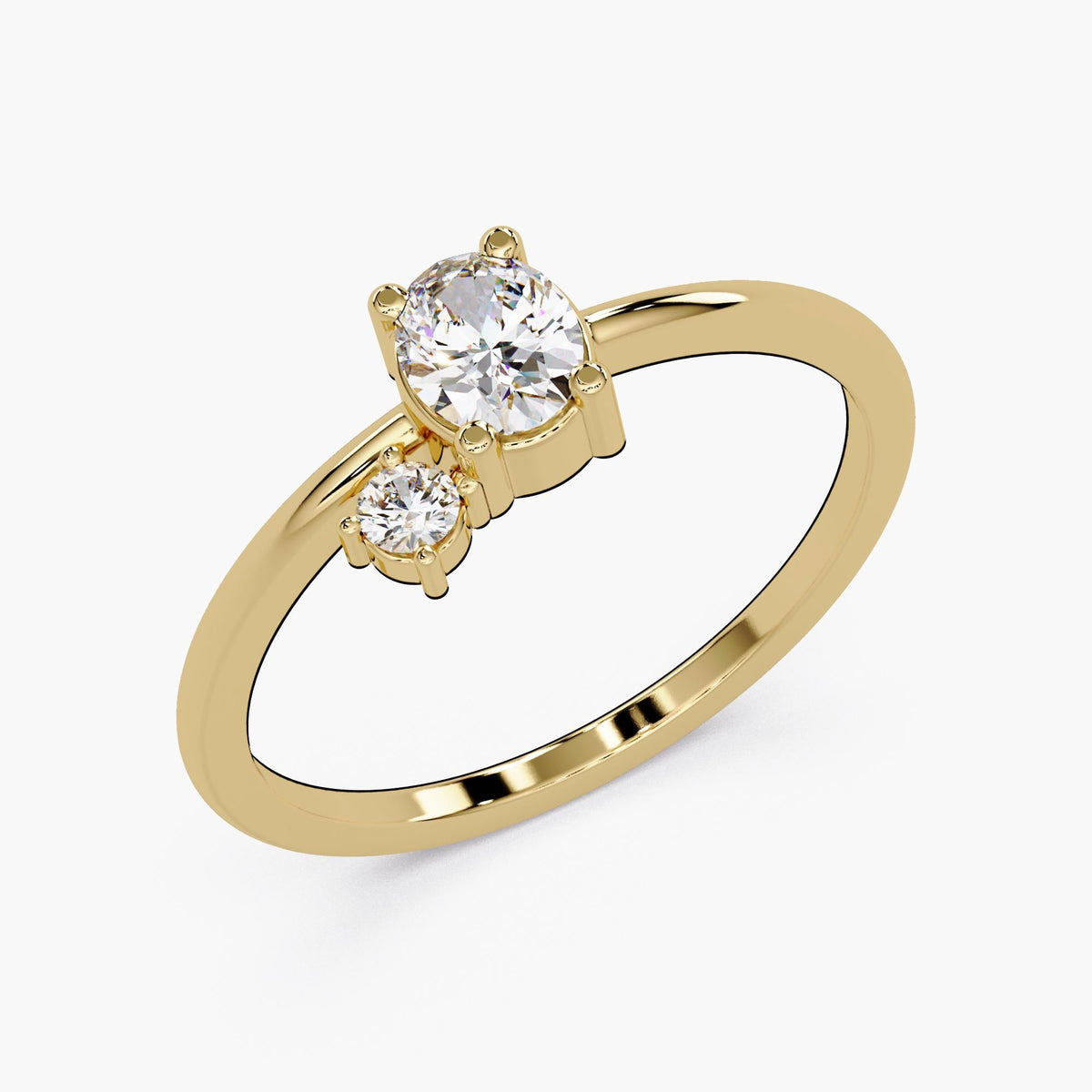 A gold ring with a large central diamond and two smaller diamonds on either side.