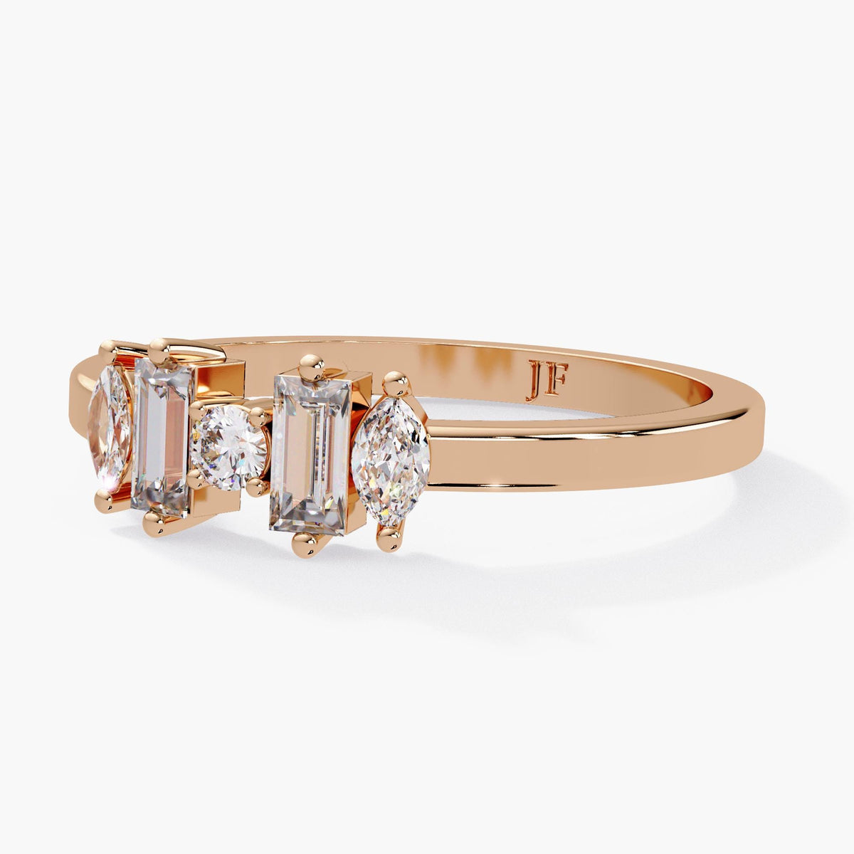 A gold ring with a row of clear gemstones, including diamonds and a large clear gemstone, set in a band.