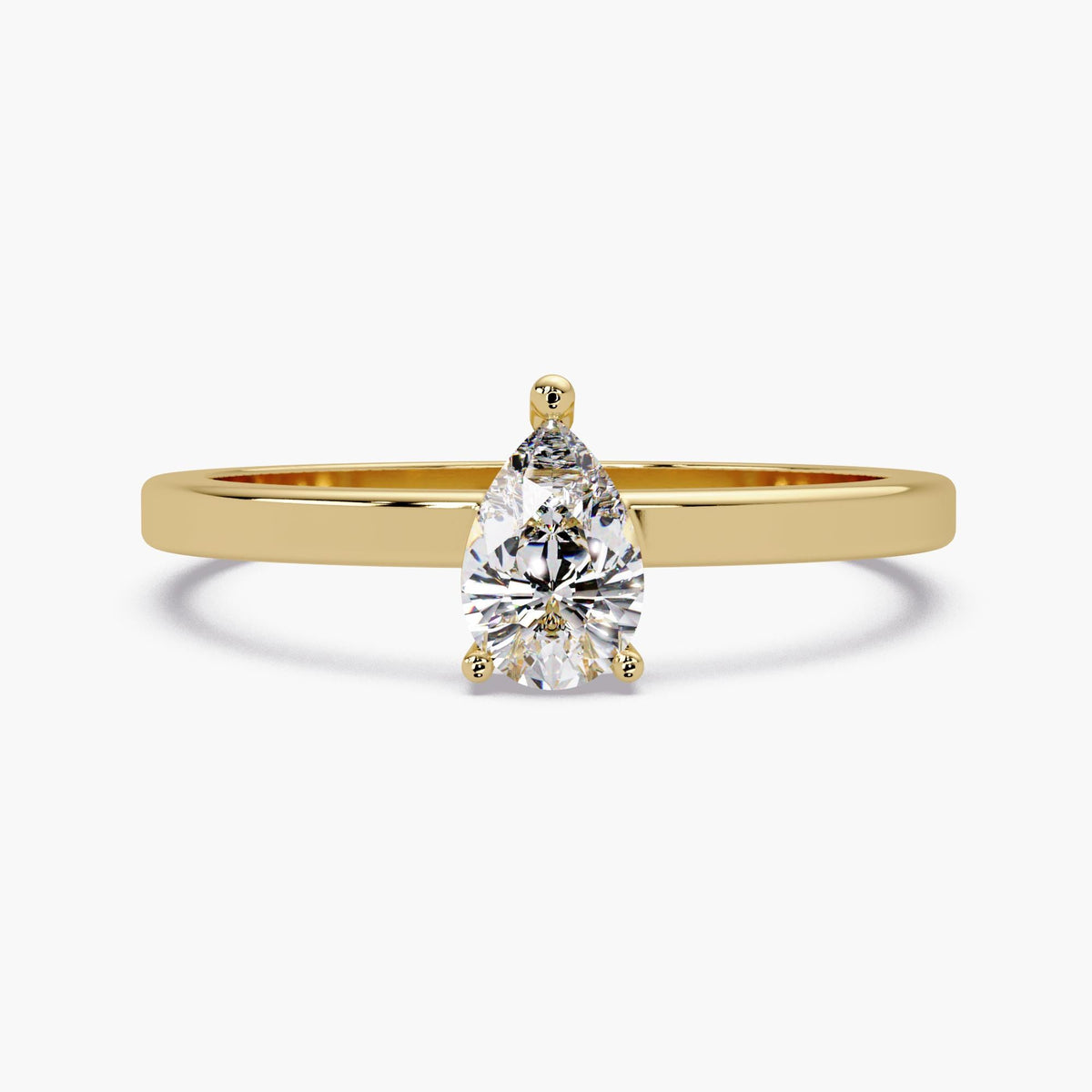 A 14K yellow gold pear lab-grown diamond solitaire ring with a 6 × 4 mm center stone secured by three prongs on a slim polished band.