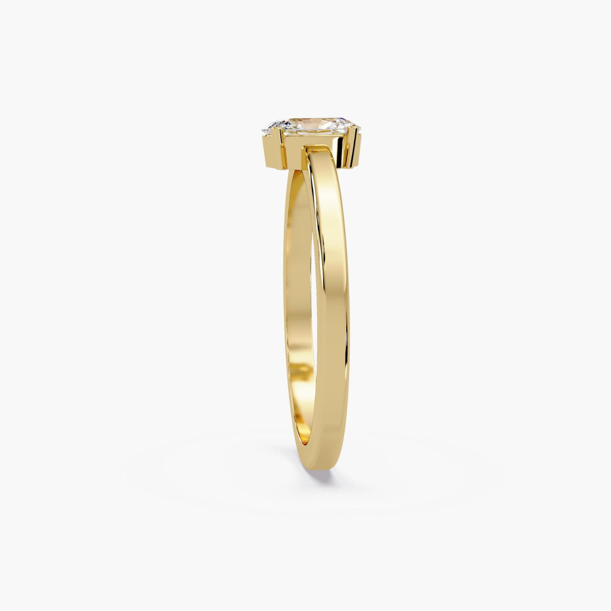 Low-profile oval lab diamond engagement ring with a four-prong setting and slim 14K gold band