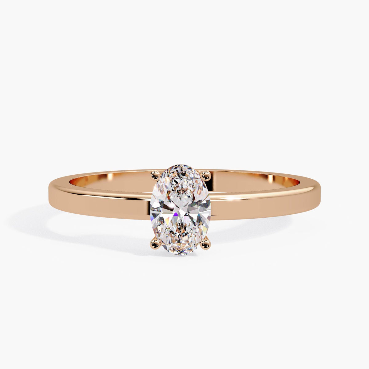 14K rose gold oval lab diamond engagement ring with a minimalist low-profile solitaire setting