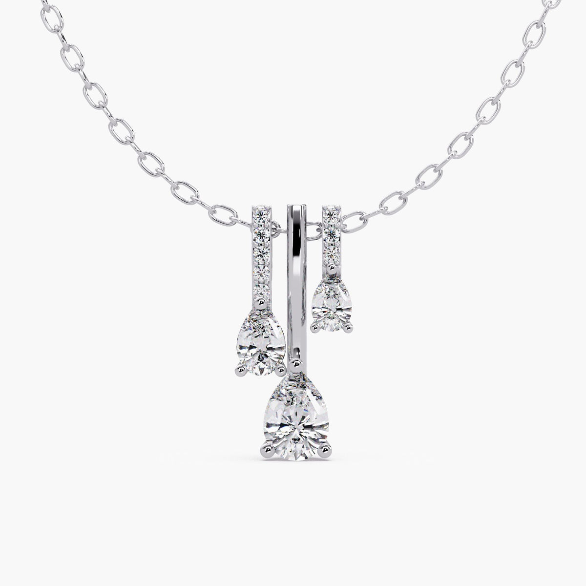 14K white gold triple pear lab-grown diamond drop necklace with three graduated pear diamonds and round pavé accents.