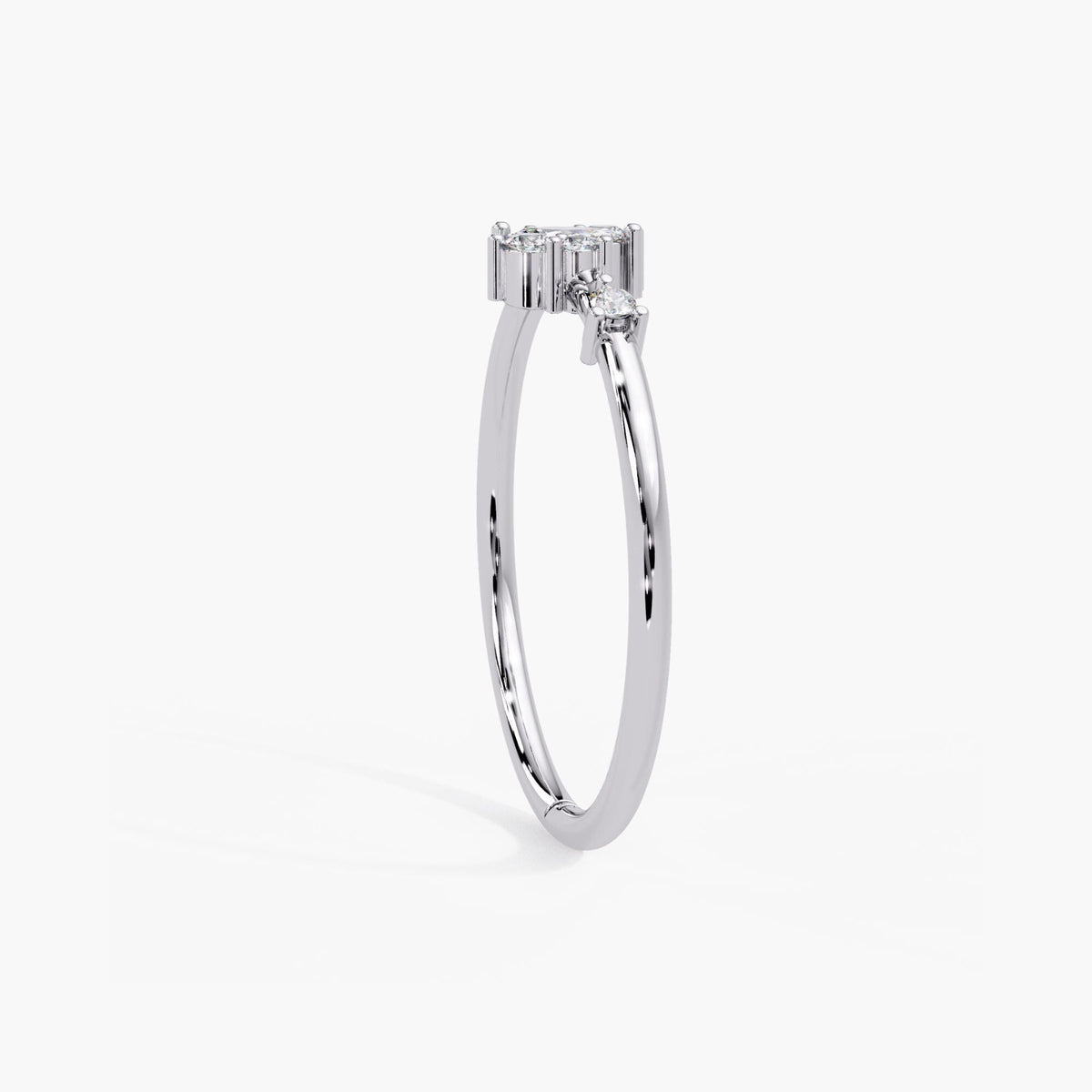 14k white gold cluster ring standing upright, showing the thin band profile and prong set marquise diamond.